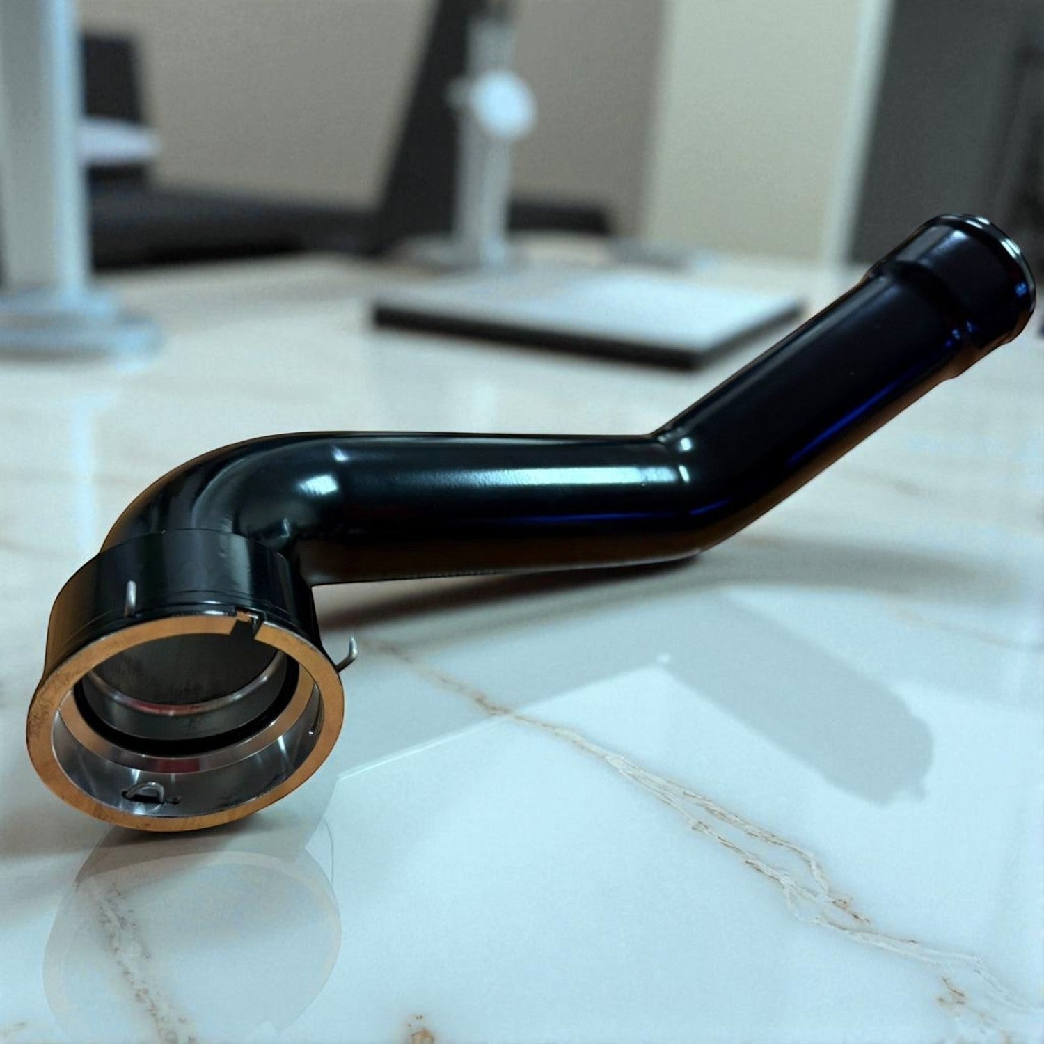 Palenon Performance black aluminum charge pipe for BMW and Toyota Supra B58 engines with CNC-machined flange.
