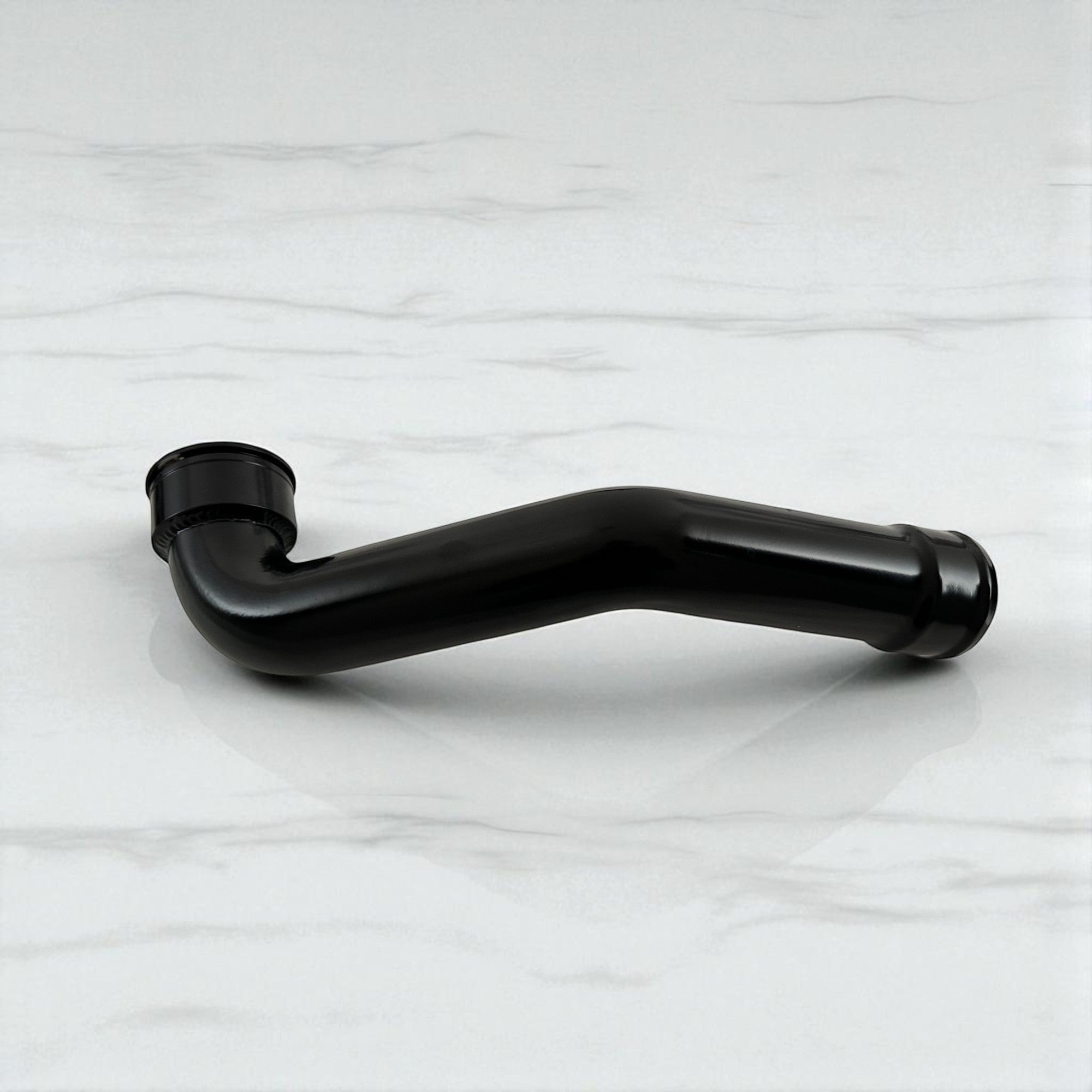 Palenon Performance black aluminum B58 charge pipe for BMW and Toyota Supra engines with a glossy powder coat finish.