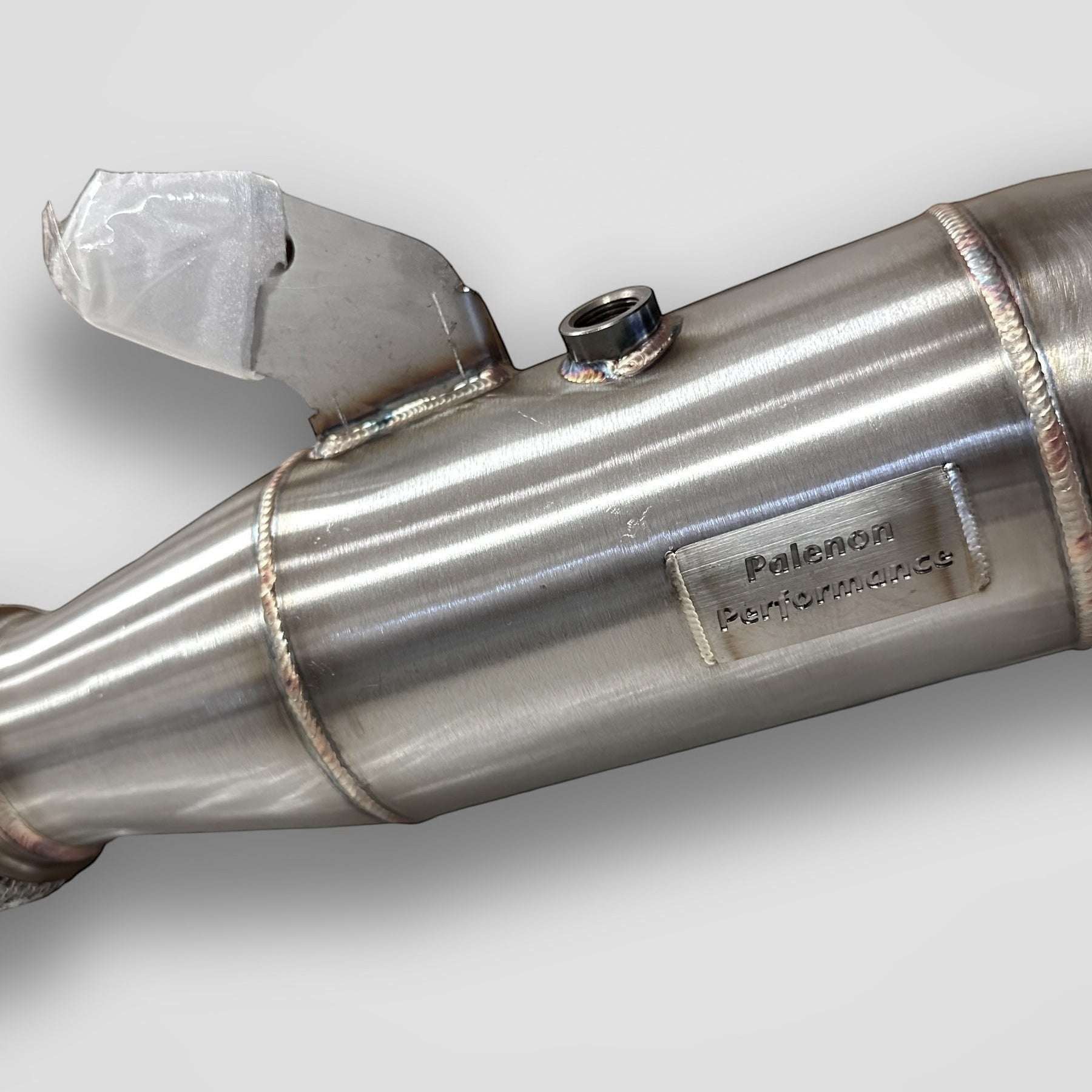Palenon Performance 4.5-inch stainless steel racing downpipe for BMW B58 engines with welded branding plate
