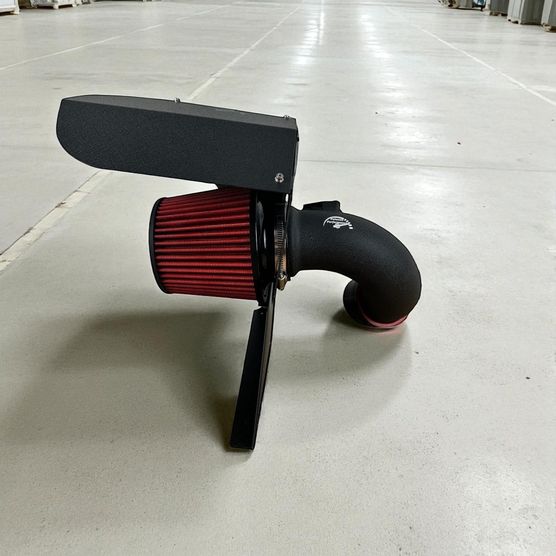 Palenon Performance cold air intake for BMW B48 and B46 engines with red high-flow filter and black heat shield.