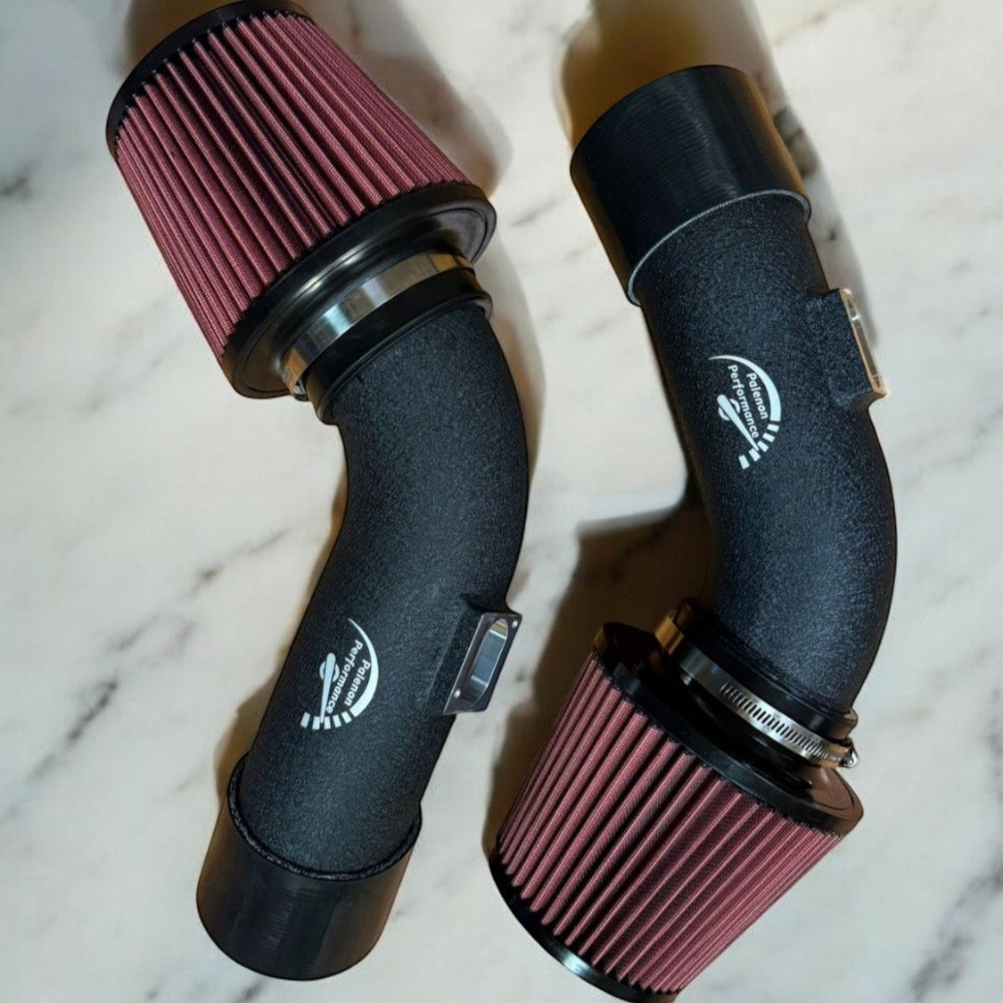 Palenon Performance dual cone cold air intake for BMW F10 M5 and F12 M6 with matte black pipes and red filters.