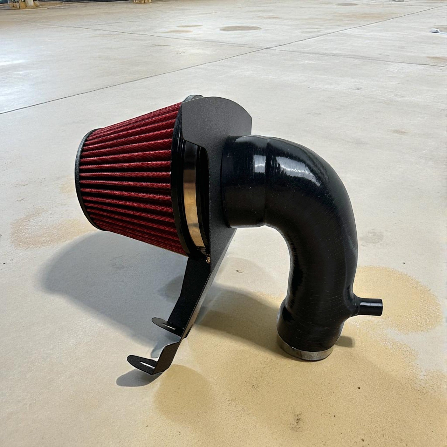 Palenon Performance cold air intake system with red velocity stack filter, black silicone pipe, and heat shield.