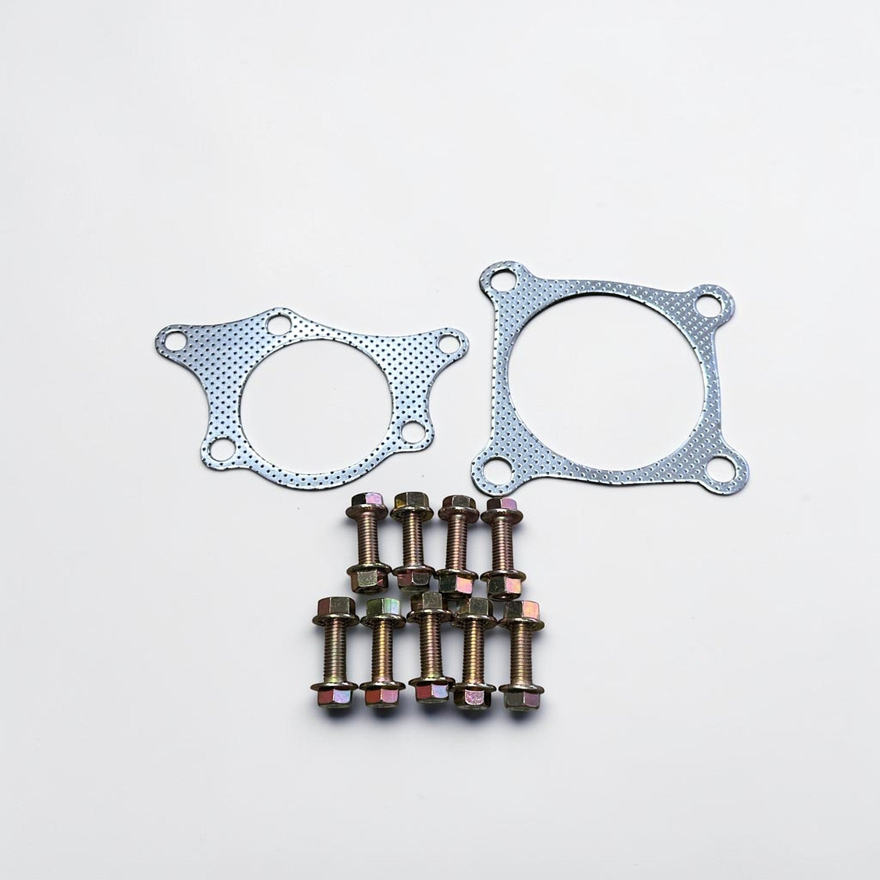 Palenon Performance downpipe installation hardware kit including two metal gaskets and eight bolts on a white background