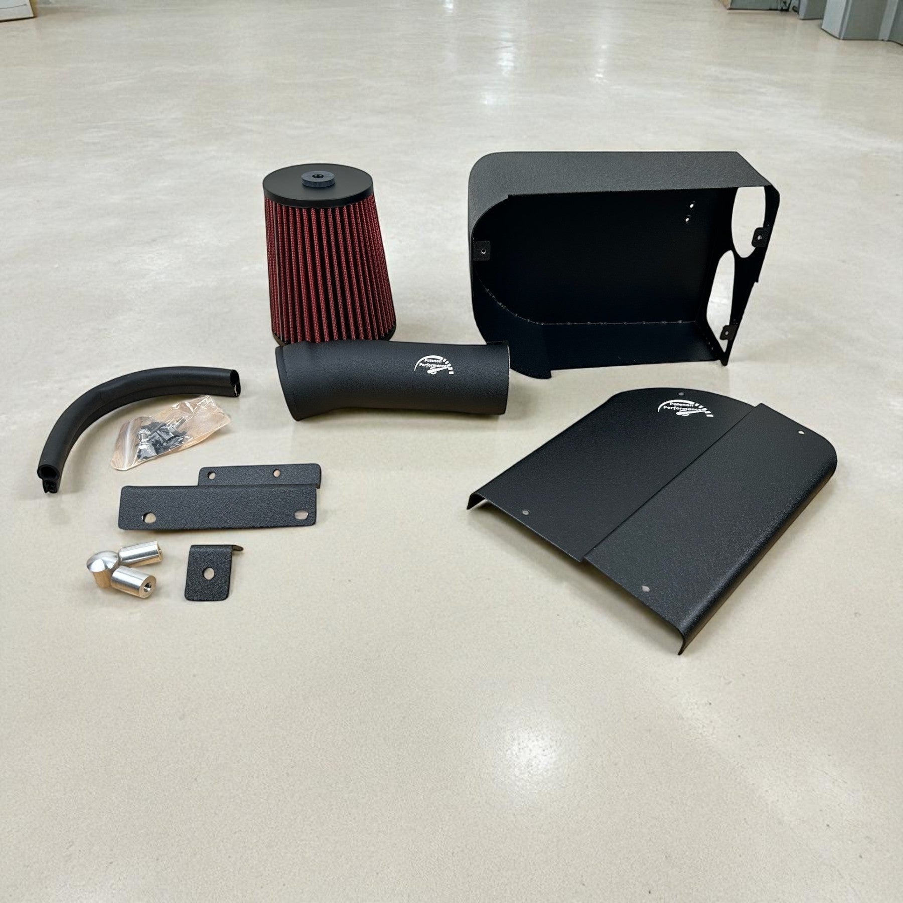 Palenon Performance M274 cold air intake kit with black aluminum heat shield, piping, and red reusable air filter.