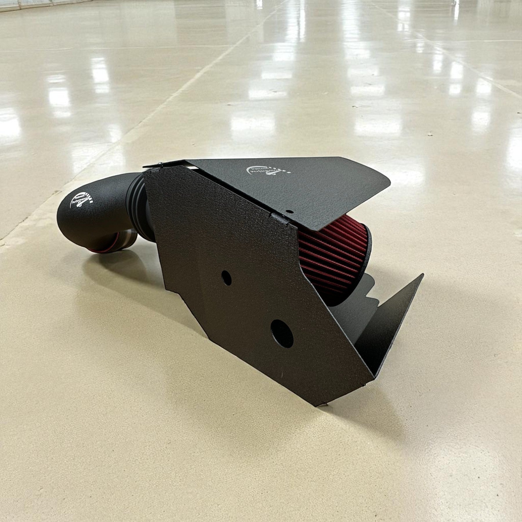 Palenon Performance cold air intake system for VW MK8 with black powder-coated heat shield and red cone air filter
