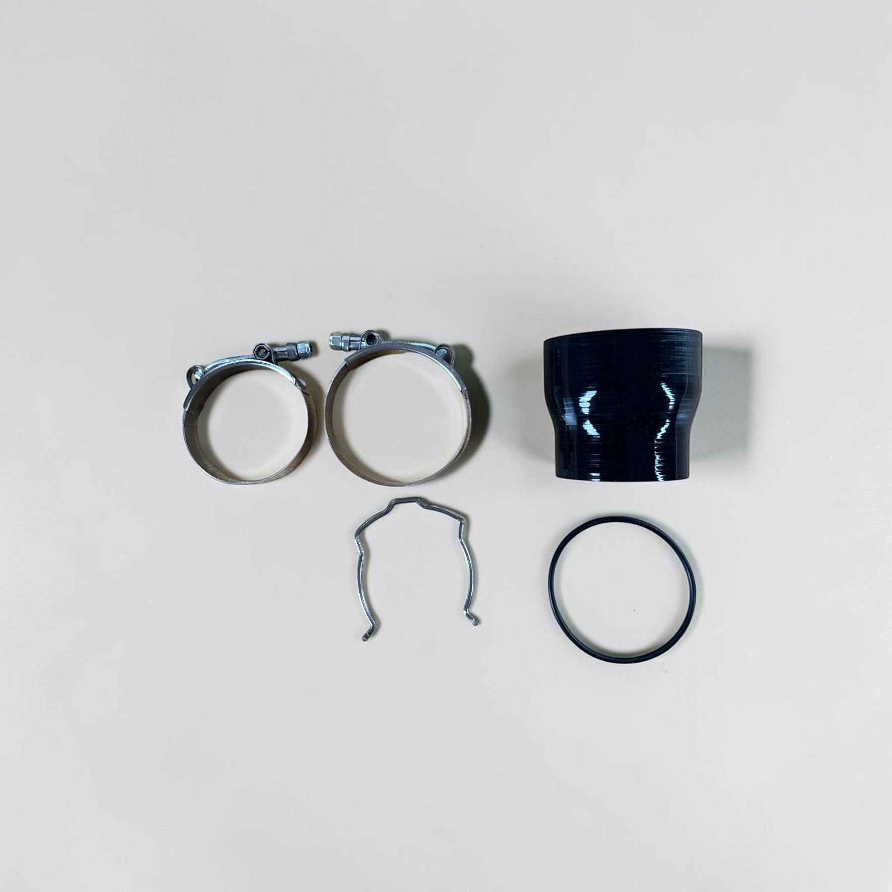 Palenon Performance N55 charge pipe installation kit with silicone coupler, metal clamps, and O-ring seal