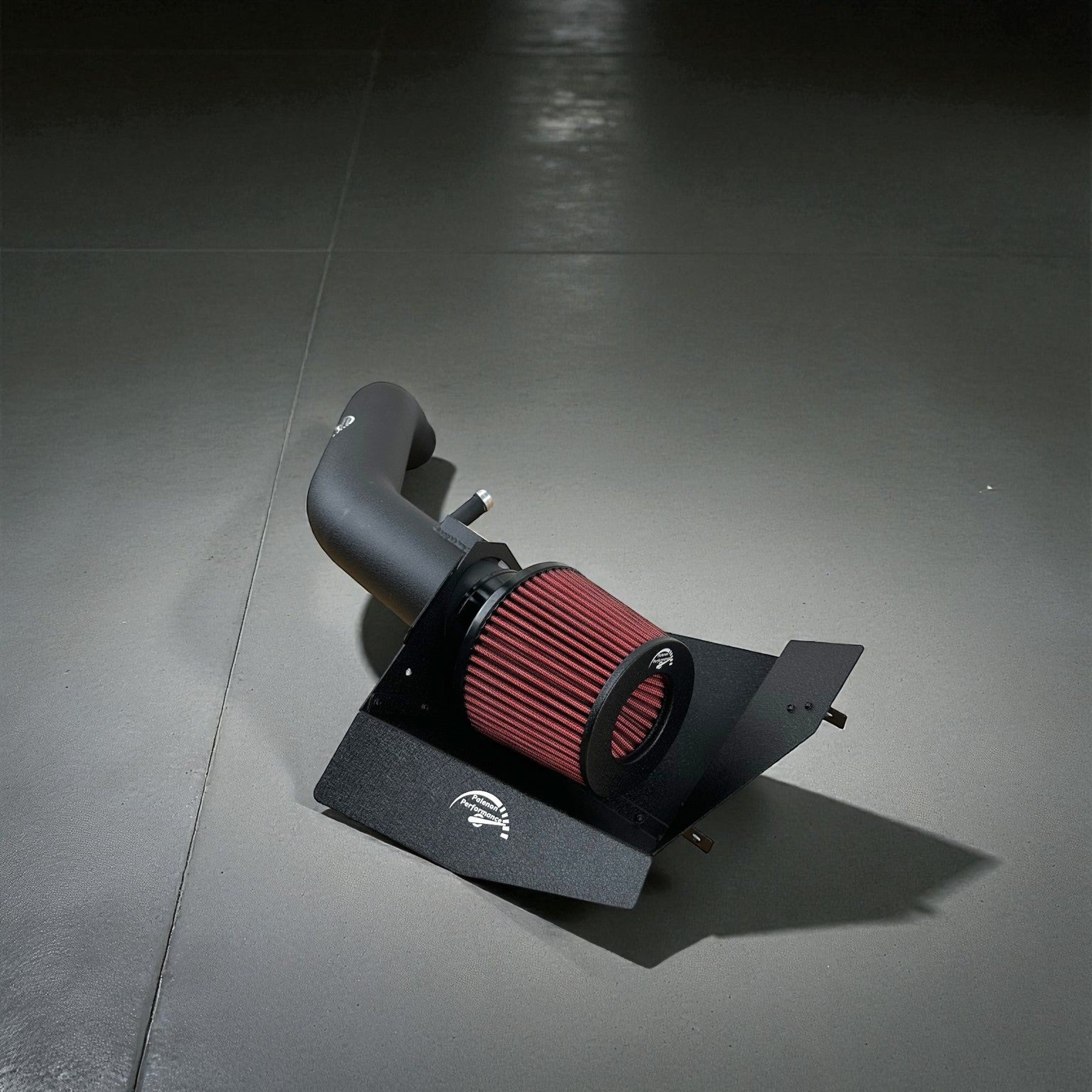 Palenon Performance cold air intake for BMW N55 engines featuring a black aluminum pipe and red performance filter.
