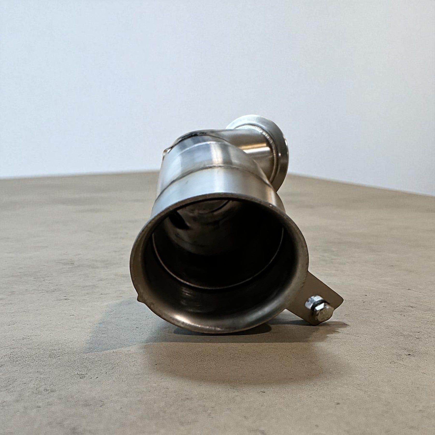 Palenon Performance stainless steel racing downpipe for BMW N55 engines showing the flared exhaust pipe opening