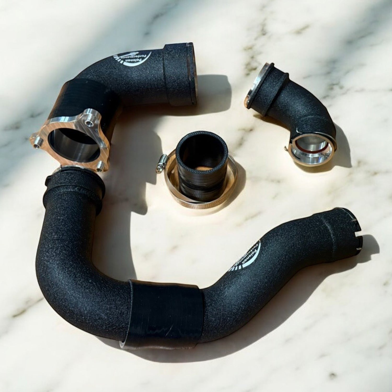 Palenon Performance black aluminum S58 charge pipes for BMW G8X and F9X engines with CNC-machined flanges and hardware.