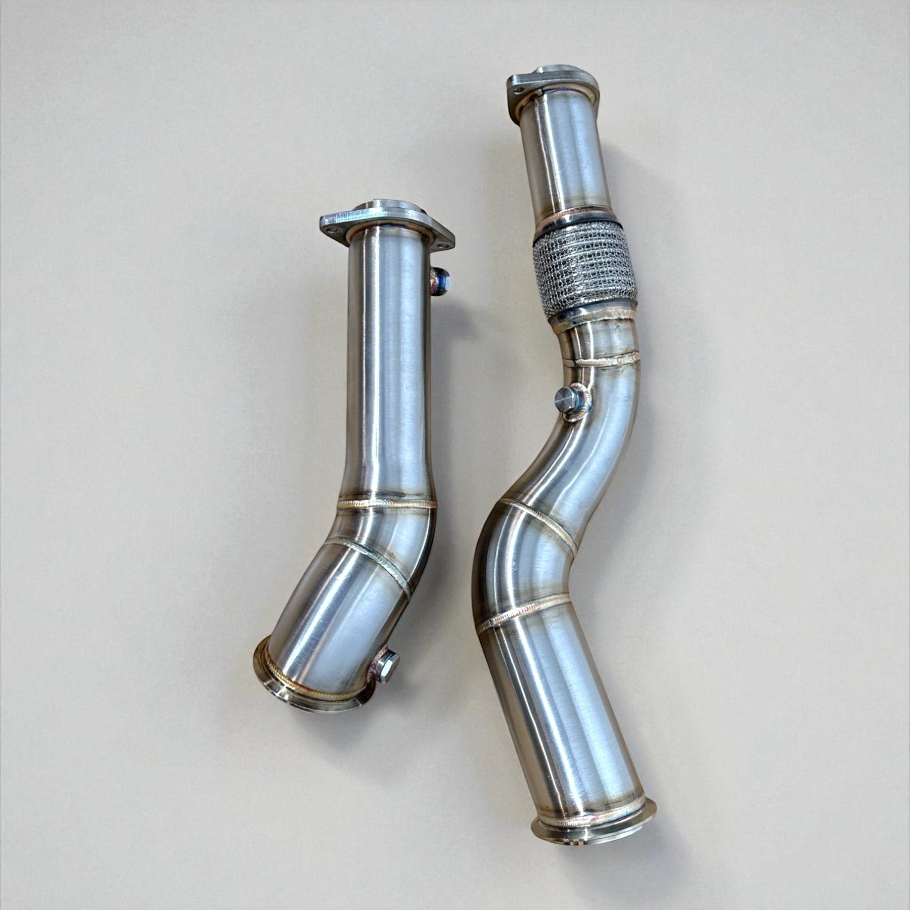 Palenon Performance stainless steel catless downpipes for BMW S58 engine, featuring mandrel-bent design.
