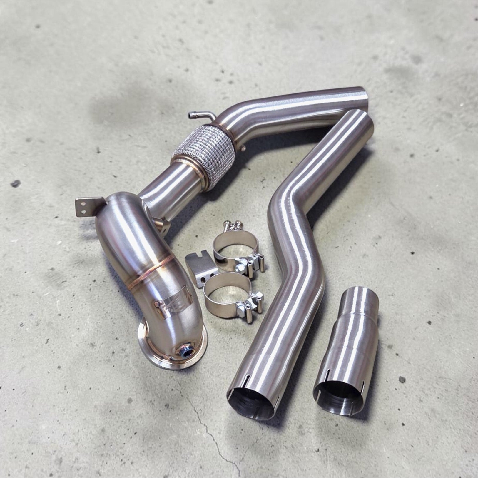 Palenon Performance stainless steel race downpipe kit for Audi S3 8Y and VW MK8 Golf R with TIG-welded tubing and clamps.