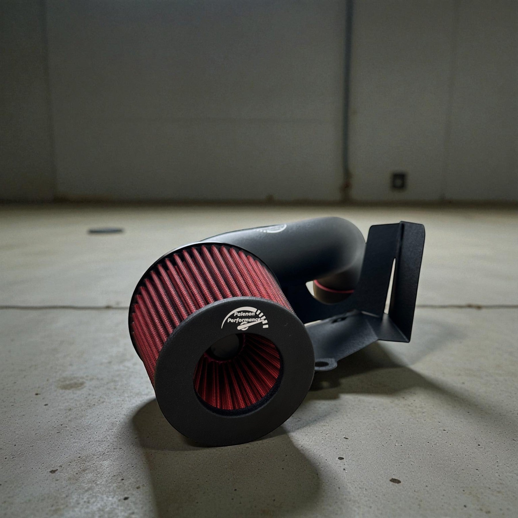 Palenon Performance cold air intake system with a red cone filter and black powder-coated aluminum pipe for VW MK7.