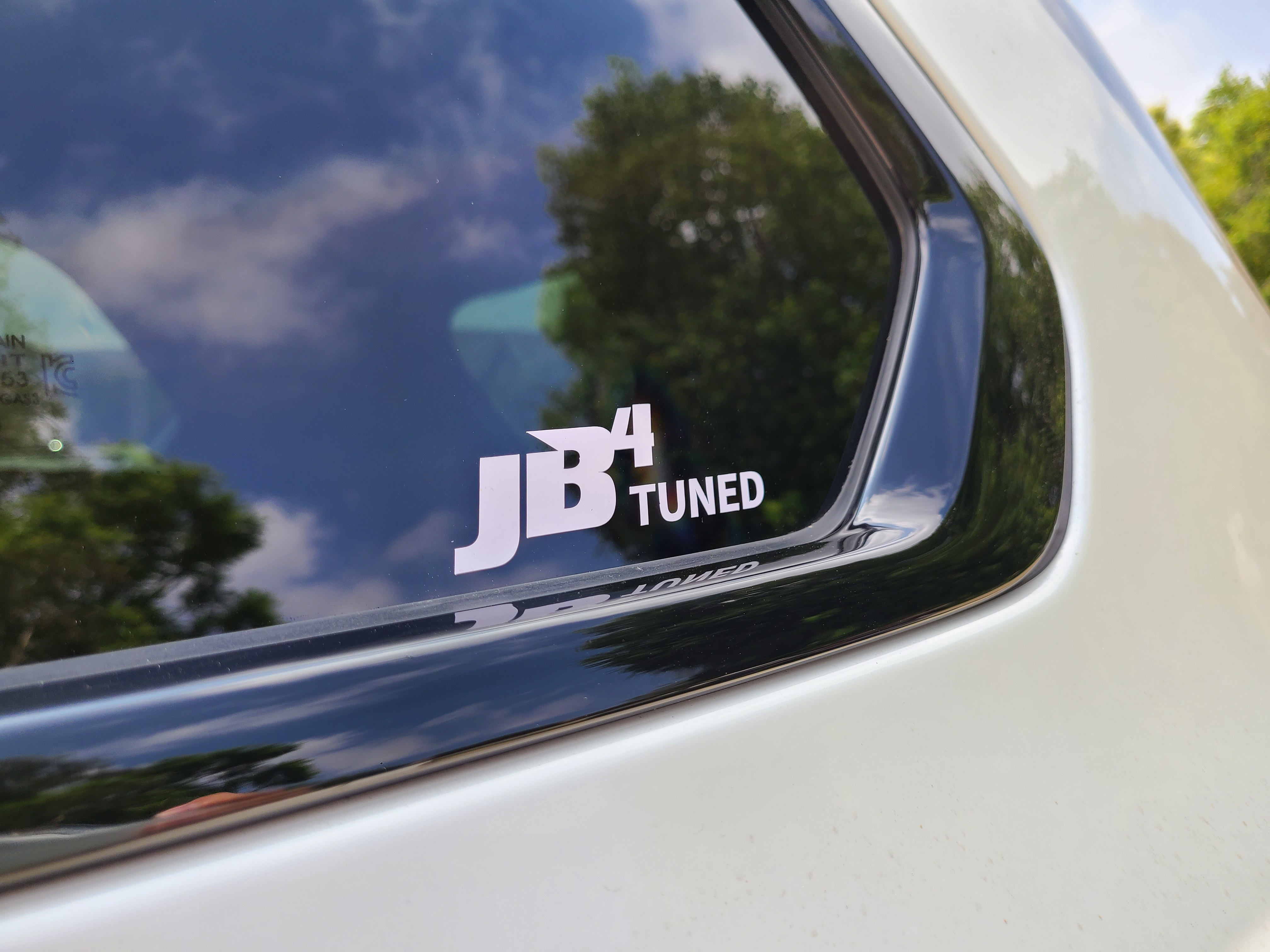 JB4 Tuned Stickers on car front glass