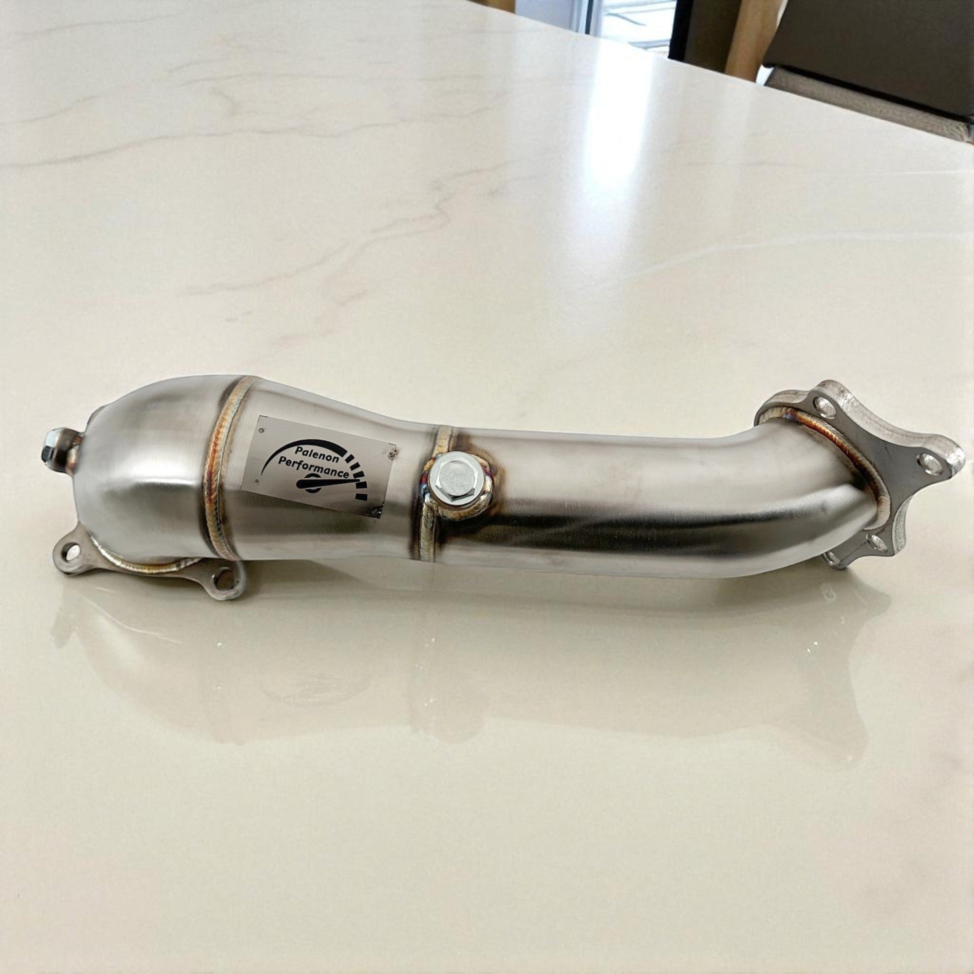 Palenon Performance stainless steel 2.0T race downpipe with polished finish and integrated catalytic converter