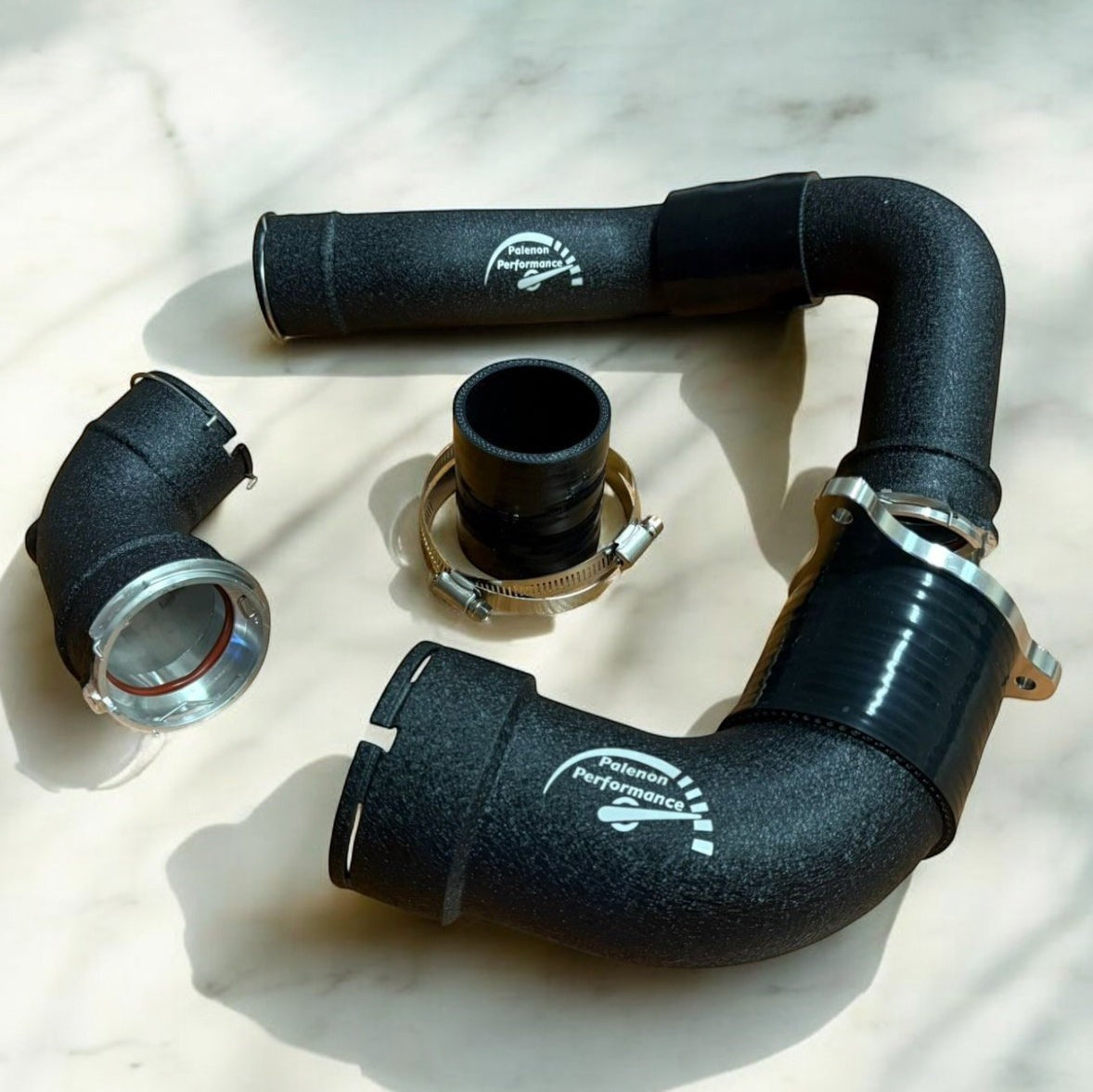 Palenon Performance matte black aluminum charge pipes for BMW S58 engines with CNC-machined flanges and silicone couplers