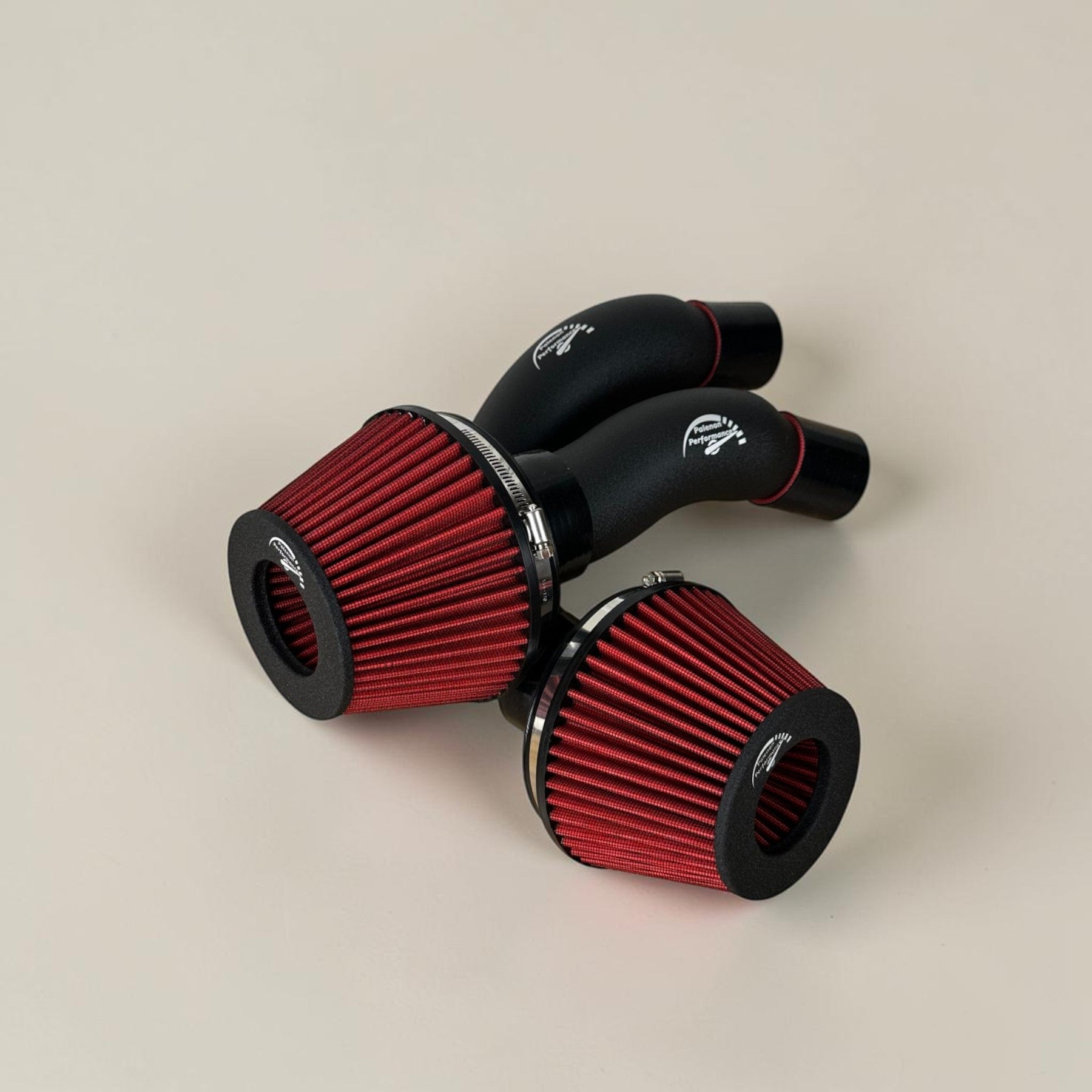 Palenon Performance cold air intake system for Audi 4.0T featuring two red cone filters and black aluminum pipes.