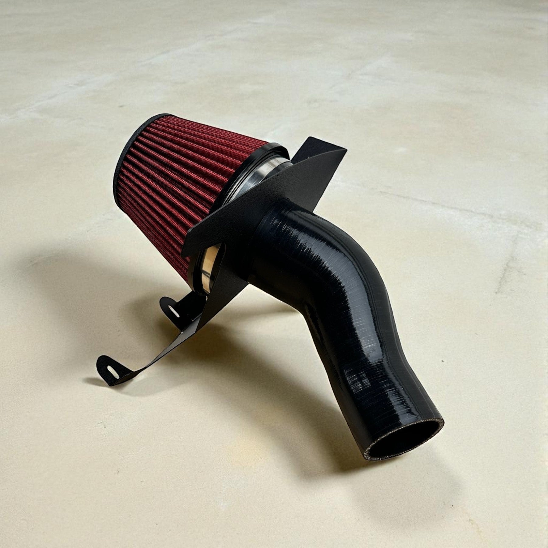 Palenon Performance cold air intake system with a red velocity stack filter, black silicone inlet, and heat shield.