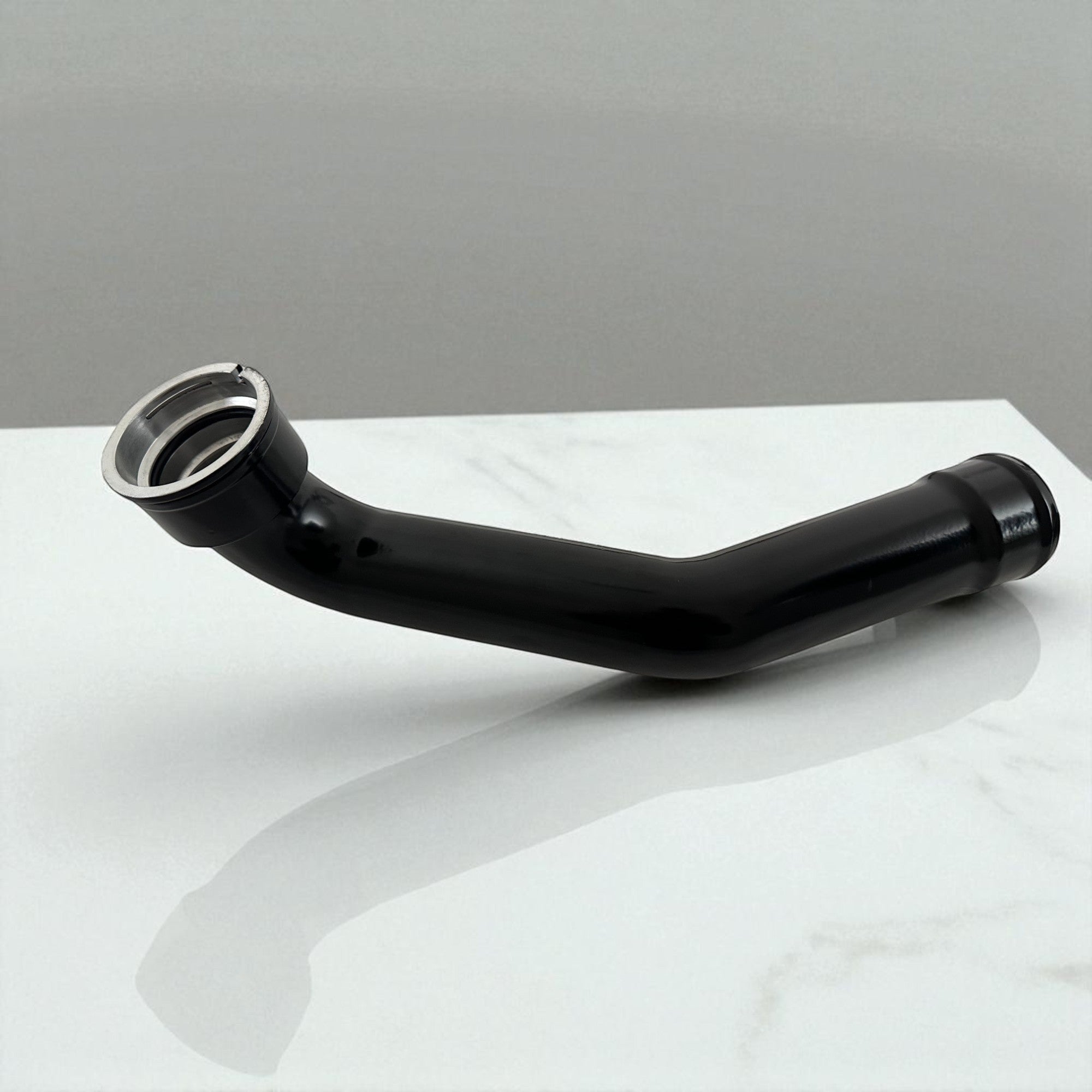 Palenon Performance black aluminum B58 charge pipe for BMW and Toyota Supra engines with CNC-machined flange