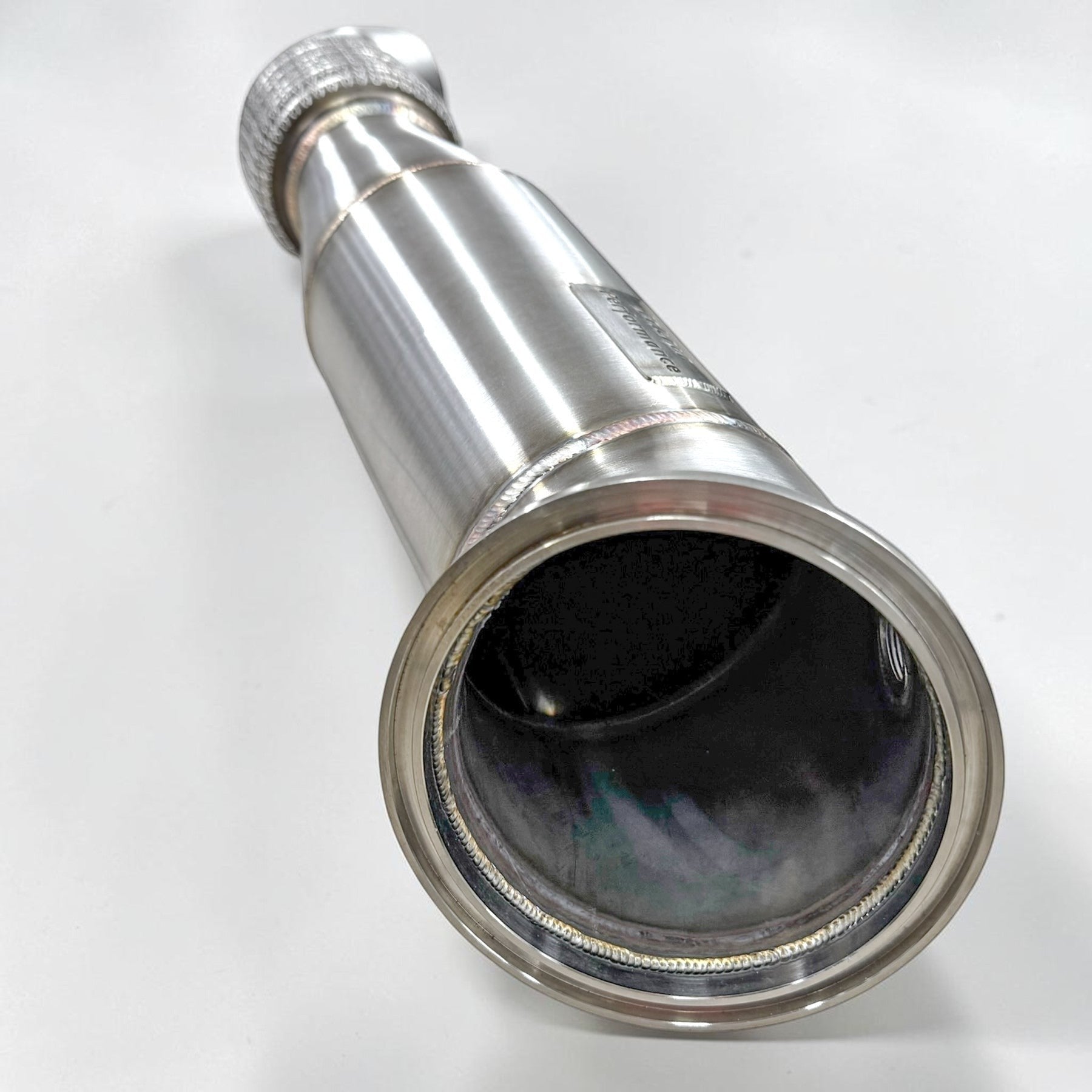 Palenon Performance 4.5-inch stainless steel racing downpipe for BMW B58 engines showing high-flow design