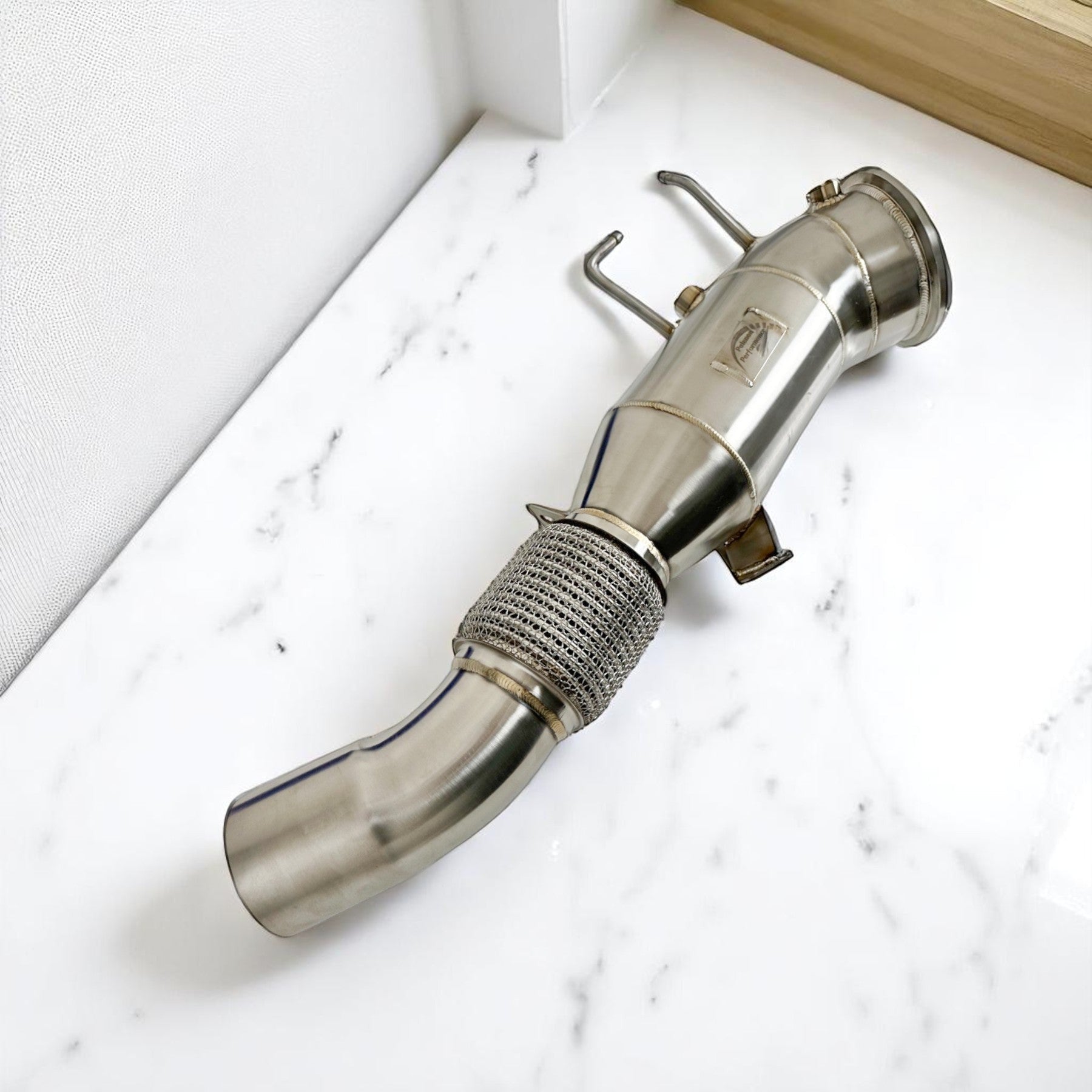 Palenon Performance 5 inch stainless steel racing downpipe for BMW B58TU2 engines with flex joint and TIG welds.