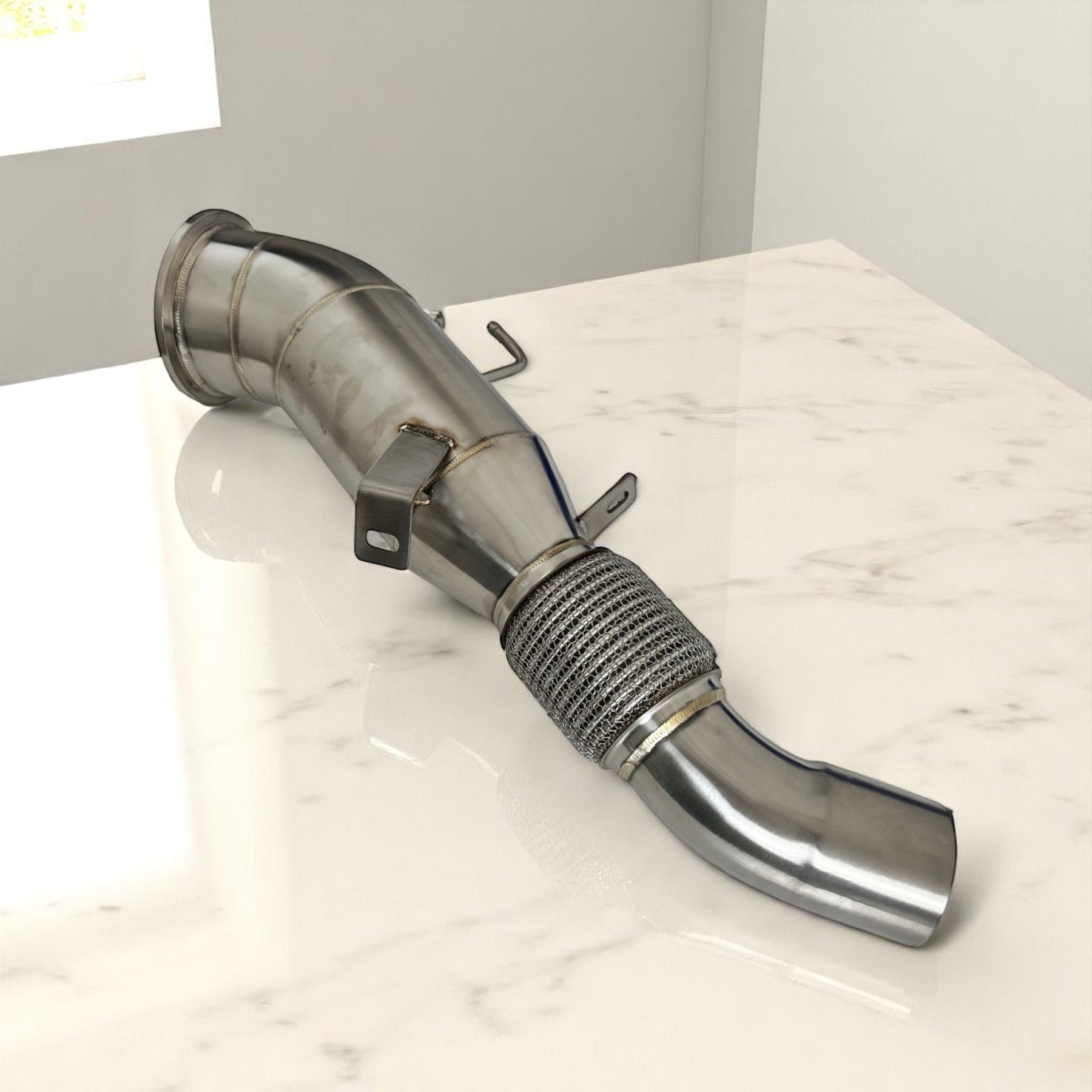 Palenon Performance 5 inch stainless steel racing downpipe for BMW B58TU2 engines with flex joint and TIG welds.