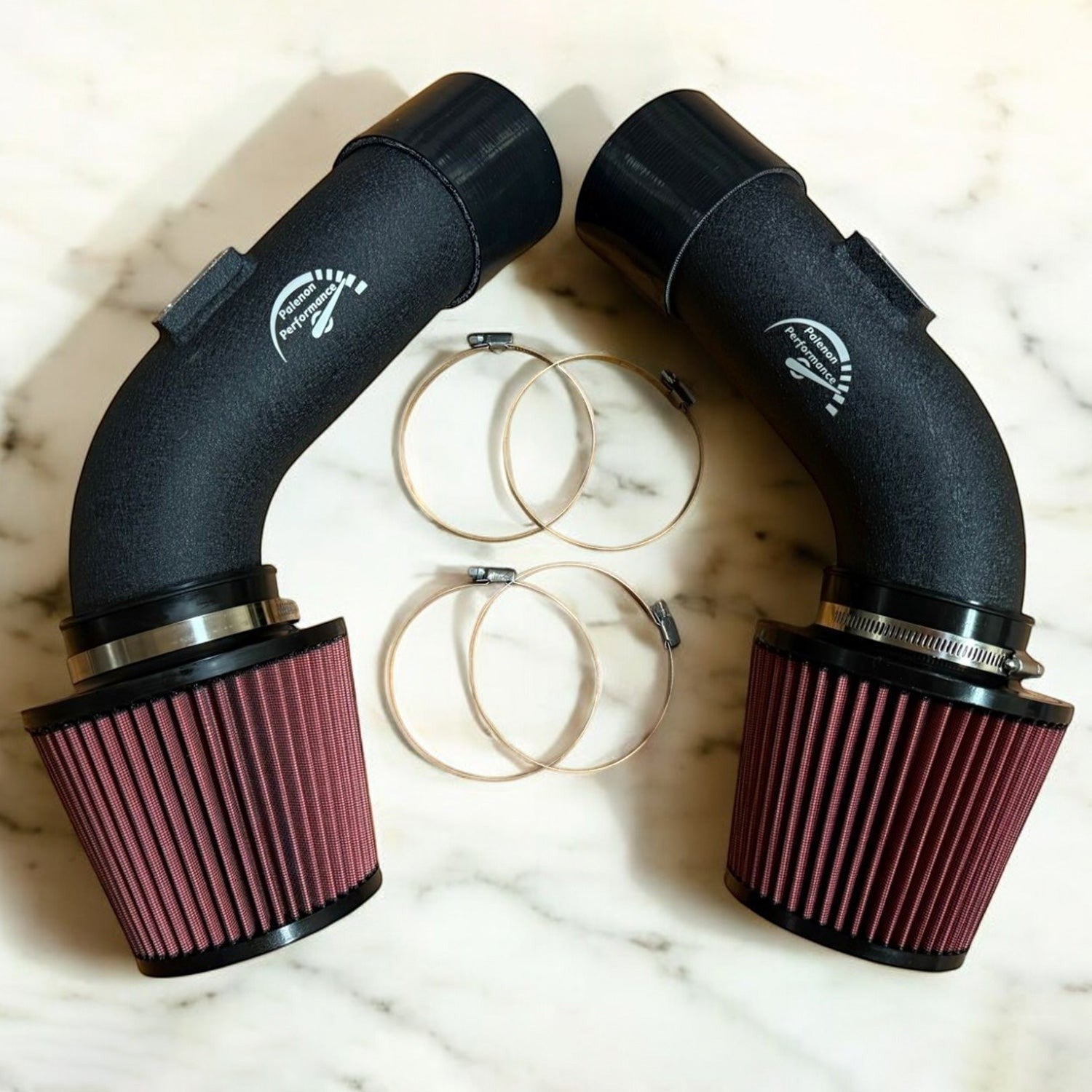 Palenon Performance dual cone cold air intake system for BMW F10 M5 and M6 with matte black pipes and red filters.