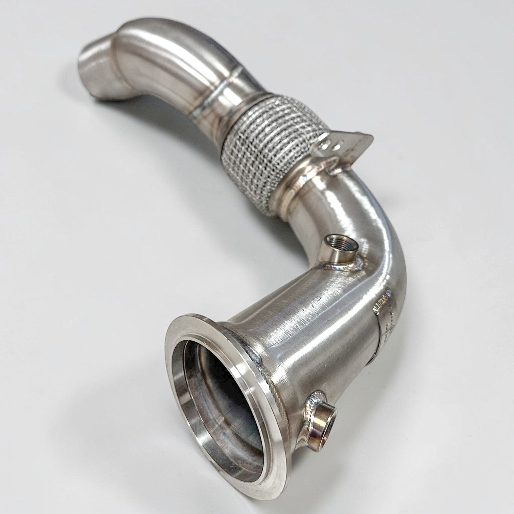 Palenon Performance stainless steel race downpipe for BMW S63 engines featuring a v-band connection and flex section.