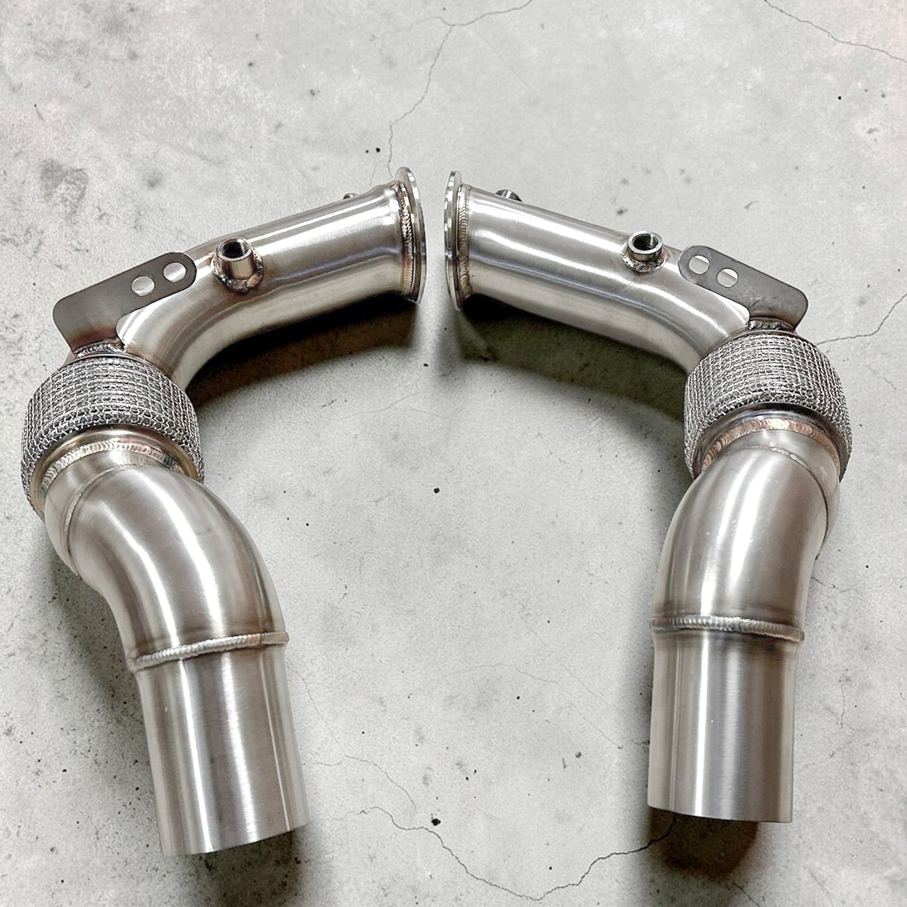 Palenon Performance stainless steel race downpipes for BMW S63 engines featuring v-band connections and flex sections