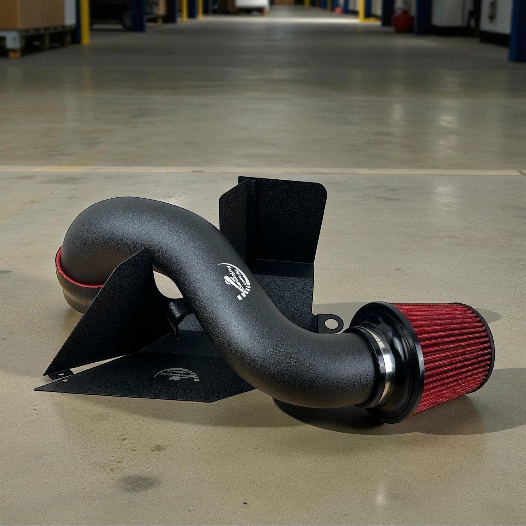 Palenon Performance cold air intake system with black powder-coated aluminum pipe, heat shield, and red cone filter.