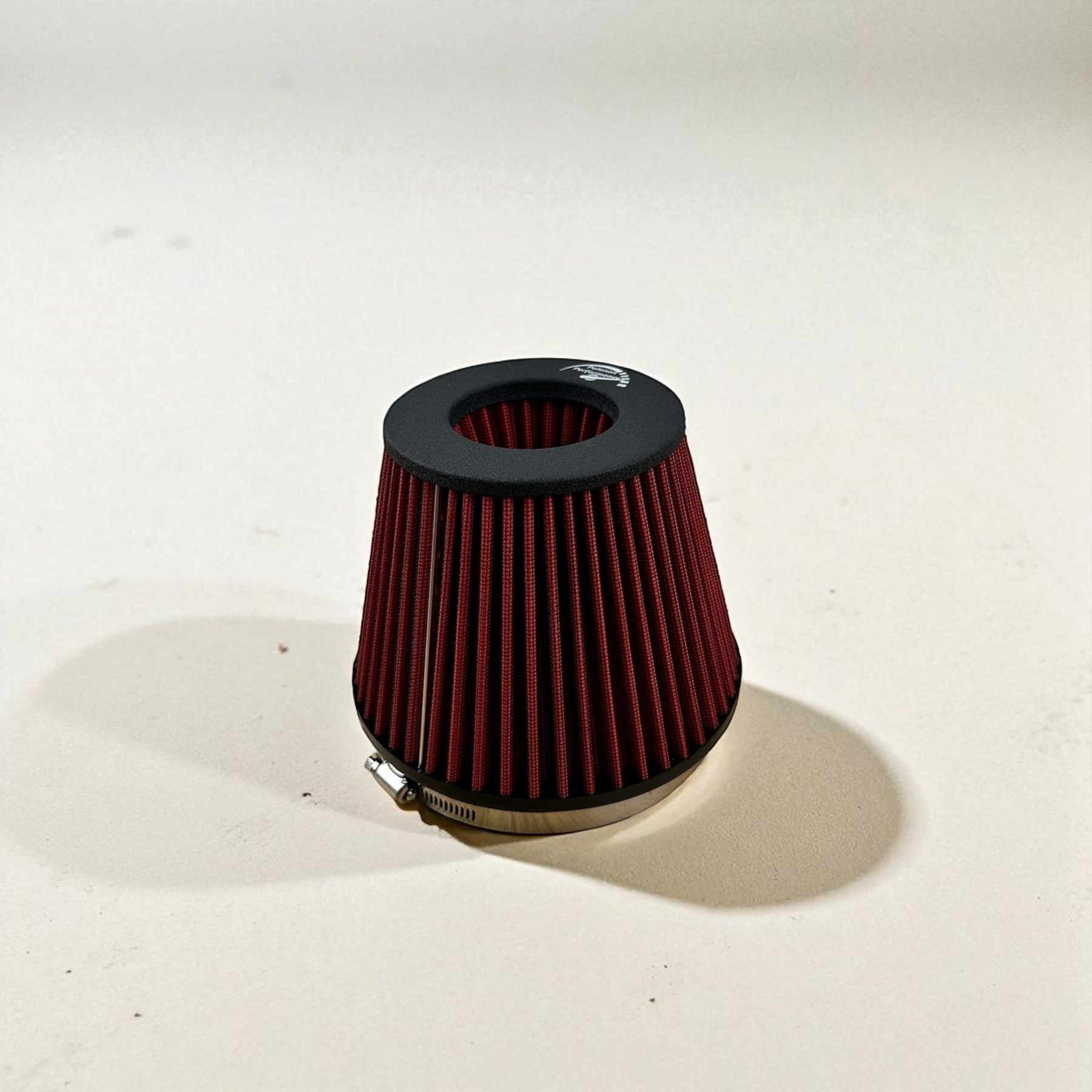 Palenon Performance high-flow conical air filter with red pleated media and black end cap for Audi 2.0T intake systems.