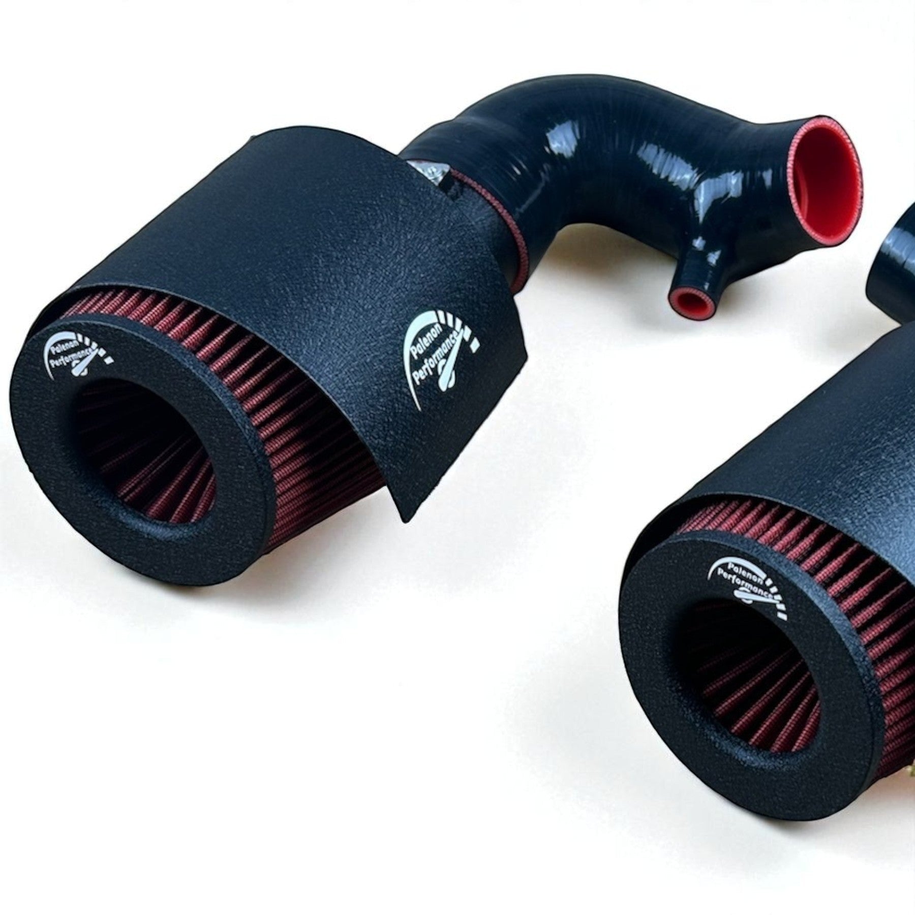 Palenon Performance cold air intake system with black heat shields, red high-flow filters, and silicone piping for Infiniti