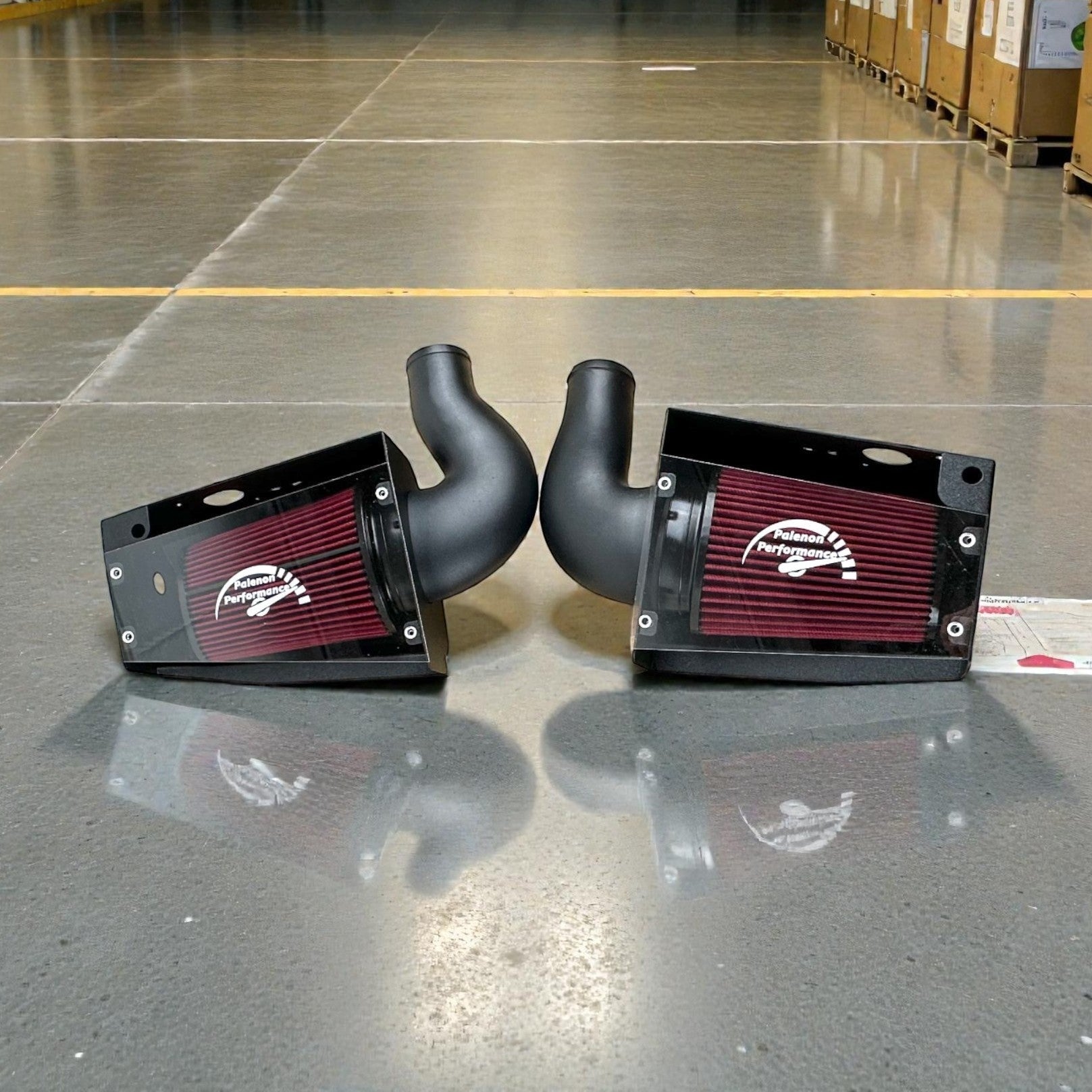Palenon Performance dual cold air intake system for Mercedes M177 engines with red filters and black heat shields.