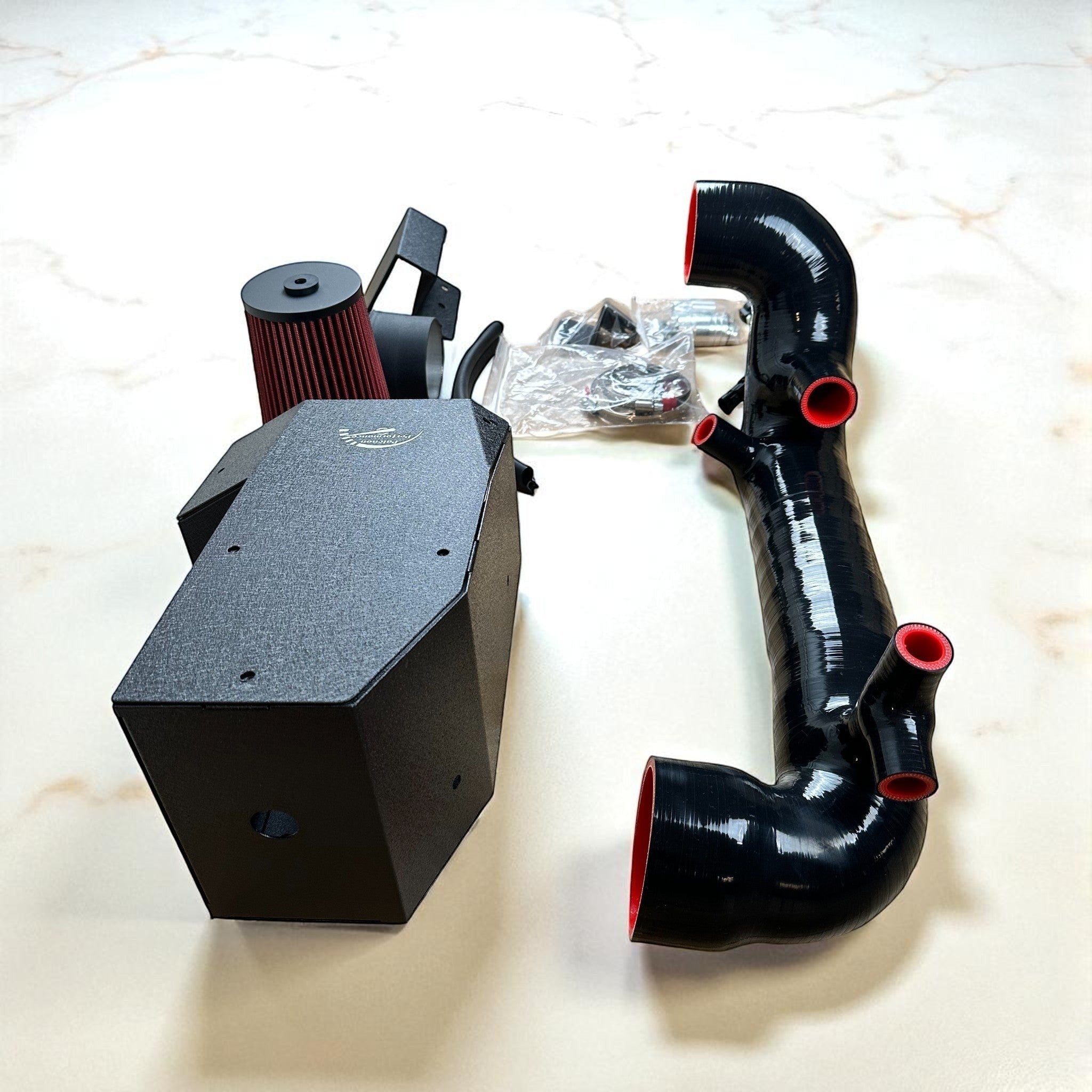 Palenon Performance M264 cold air intake kit with black heat shield, red filter, and black silicone intake hose.