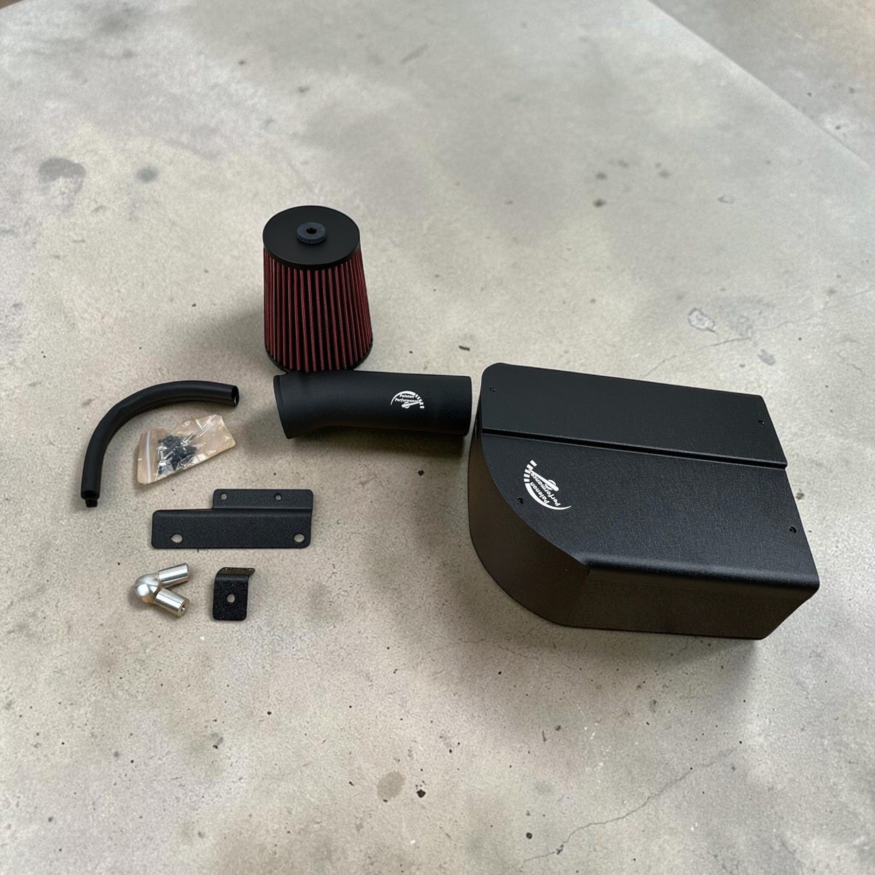 Palenon Performance M274 cold air intake kit with black aluminum heat shield, reusable air filter, and hardware.