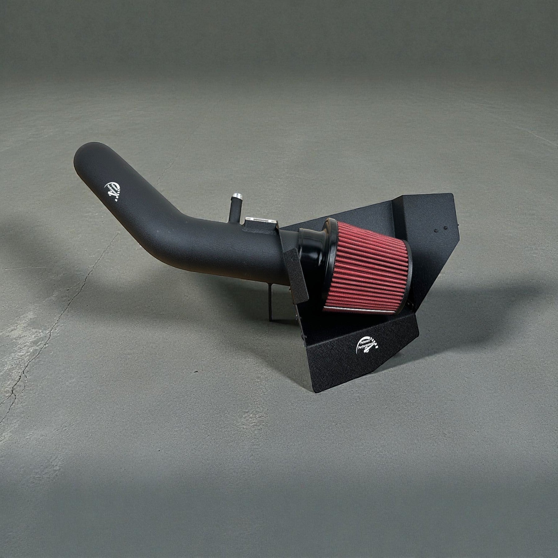 Palenon Performance black powder coated cold air intake system with red high-performance filter for BMW N55 engines.