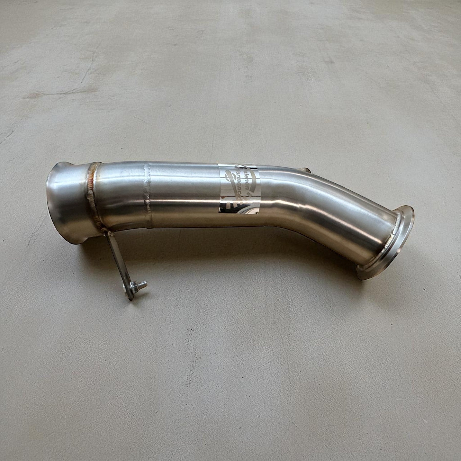 Palenon Performance N55 racing downpipe made of polished stainless steel with TIG-welded joints for BMW engines.