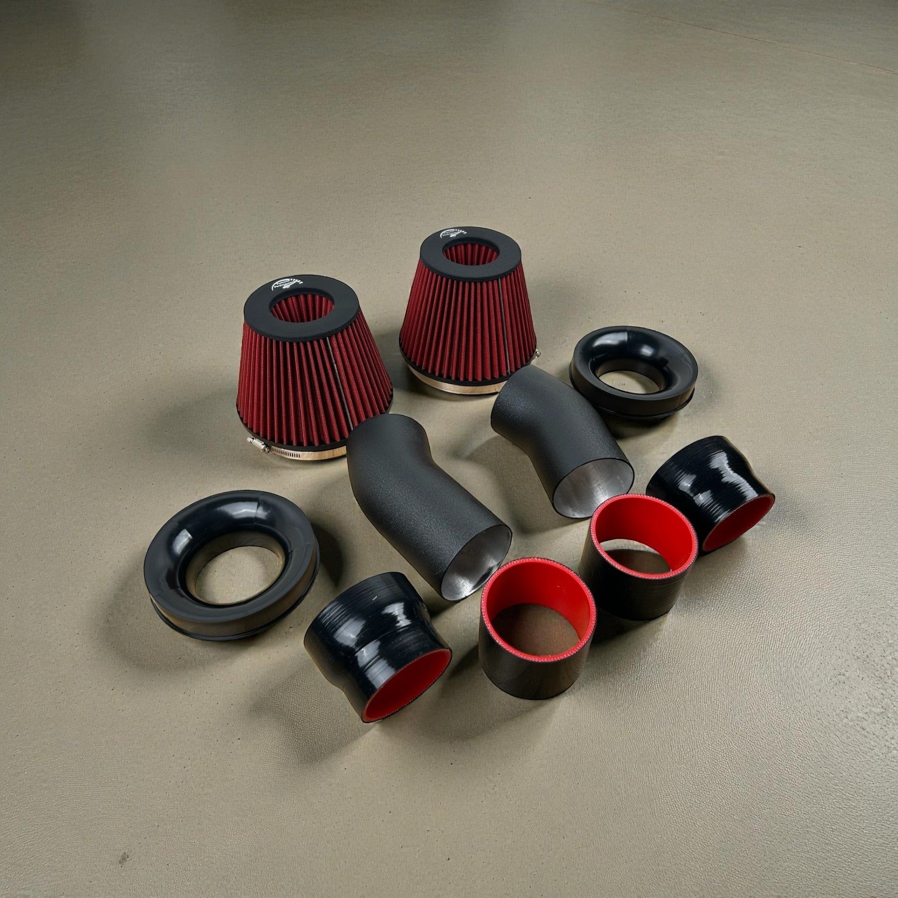 Palenon Performance N63tu3 cold air intake kit with black aluminum pipes, red filters, and silicone couplers.