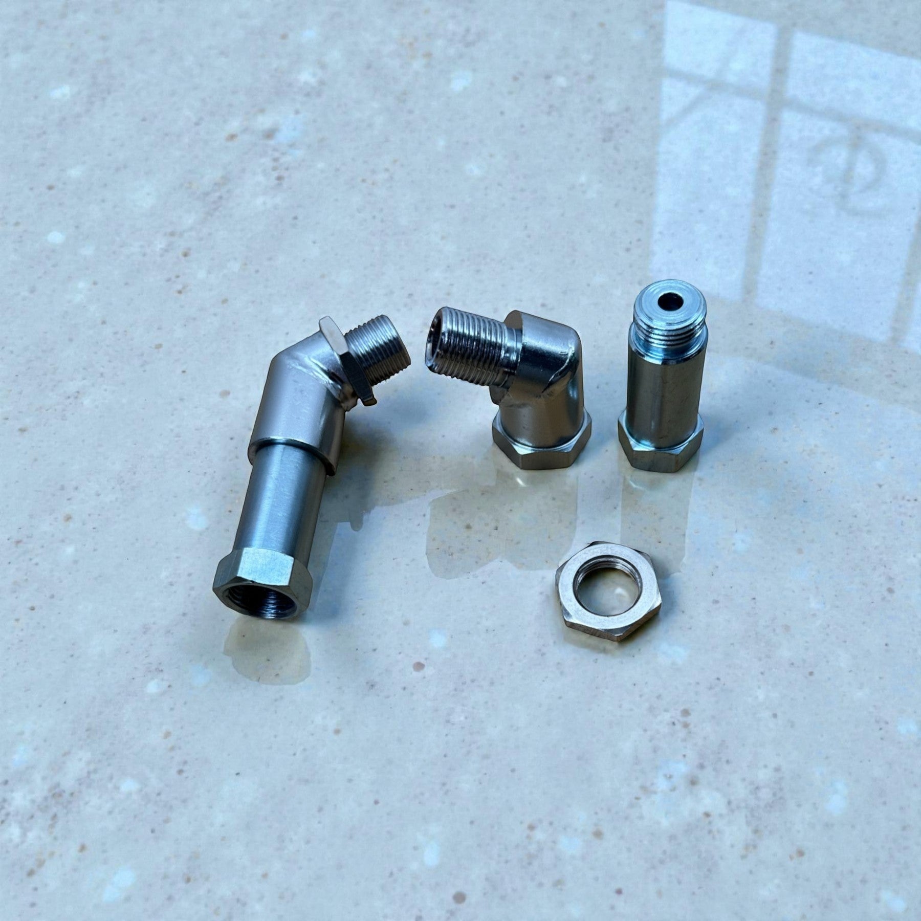 Palenon Performance CEL delete kit featuring adjustable stainless steel O2 sensor spacers for catless downpipes.