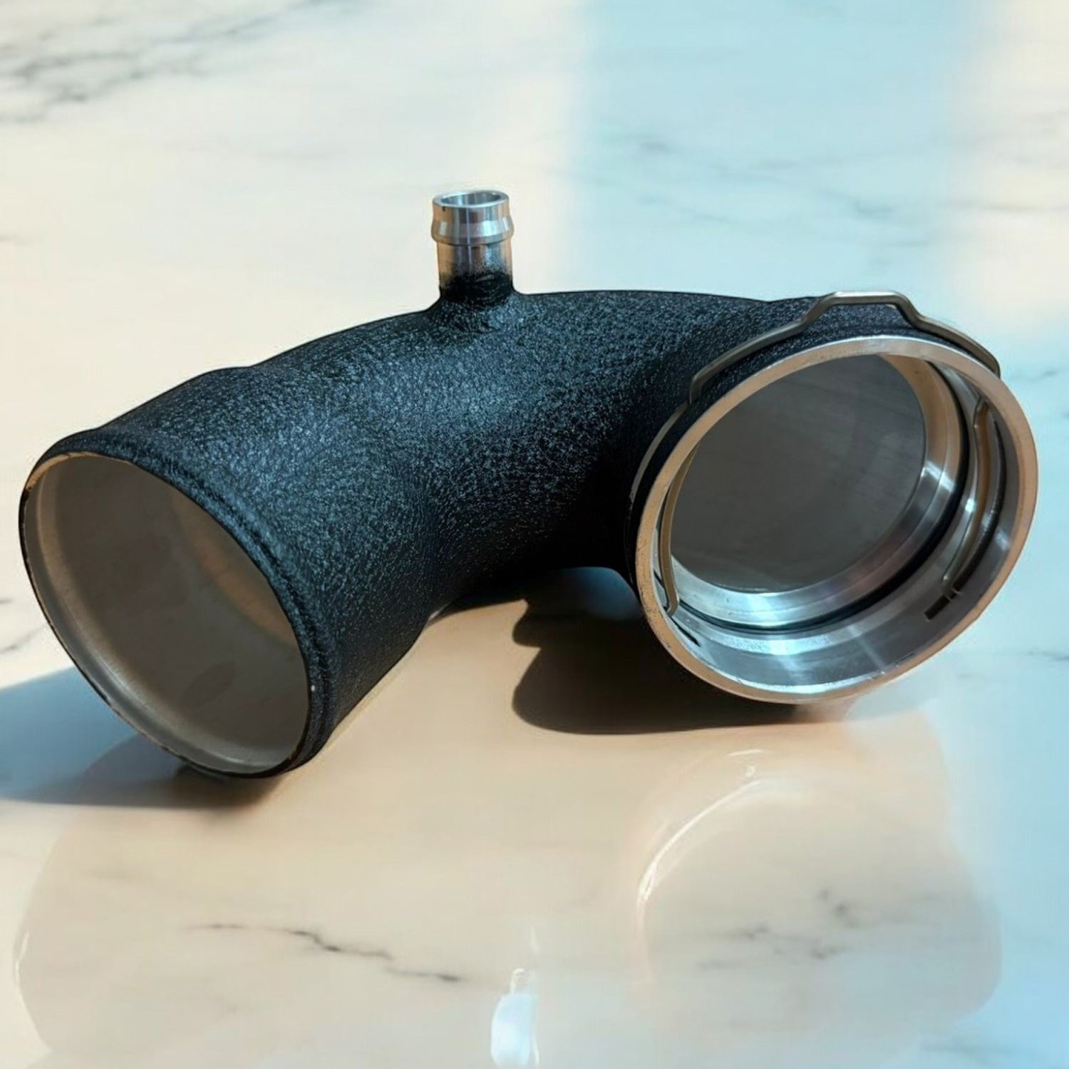 Palenon Performance aluminum S55 charge pipe with wrinkle black powder coat finish and CNC-machined flanges
