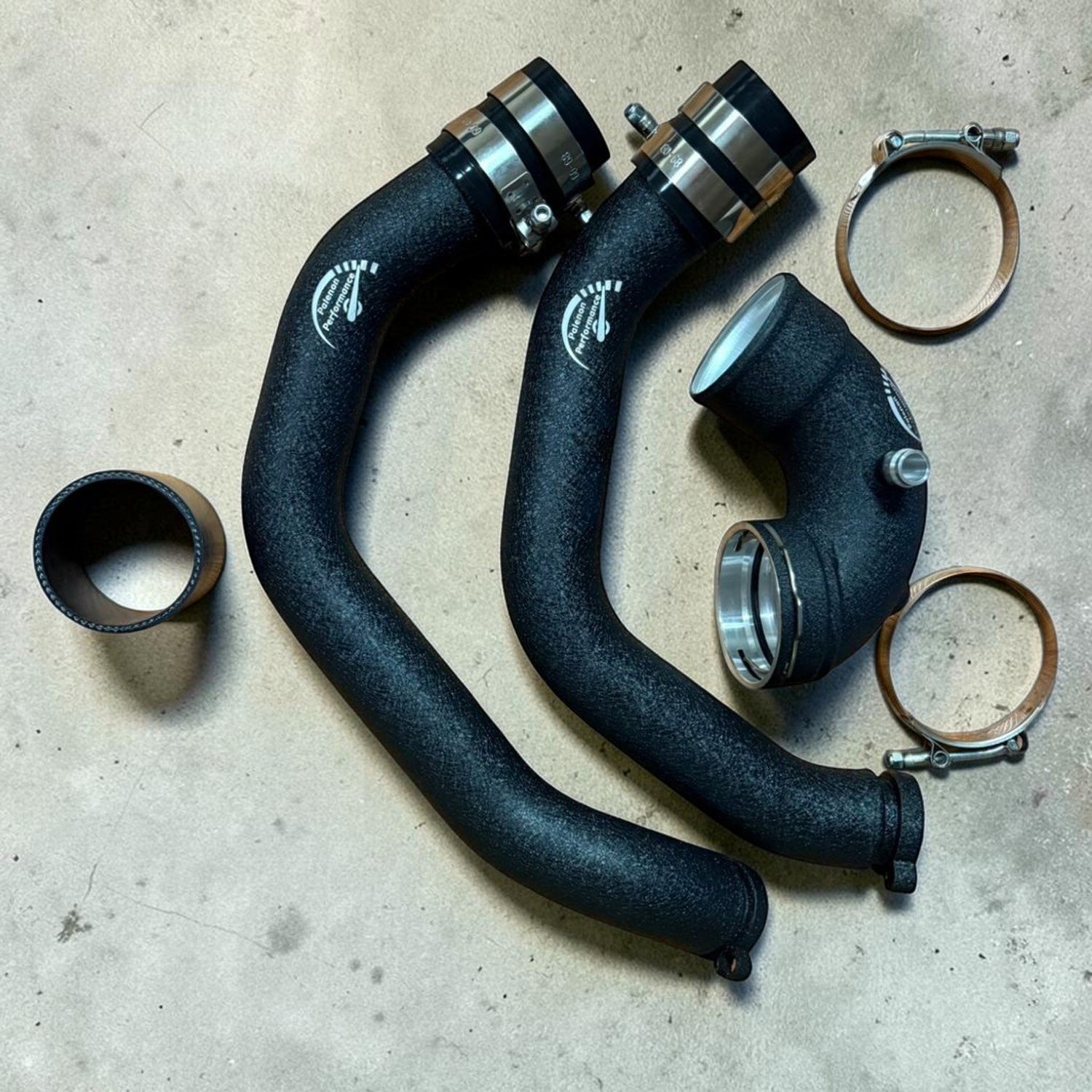 Palenon Performance aluminum charge pipes and boost pipe in wrinkle black finish for BMW S55 engines.
