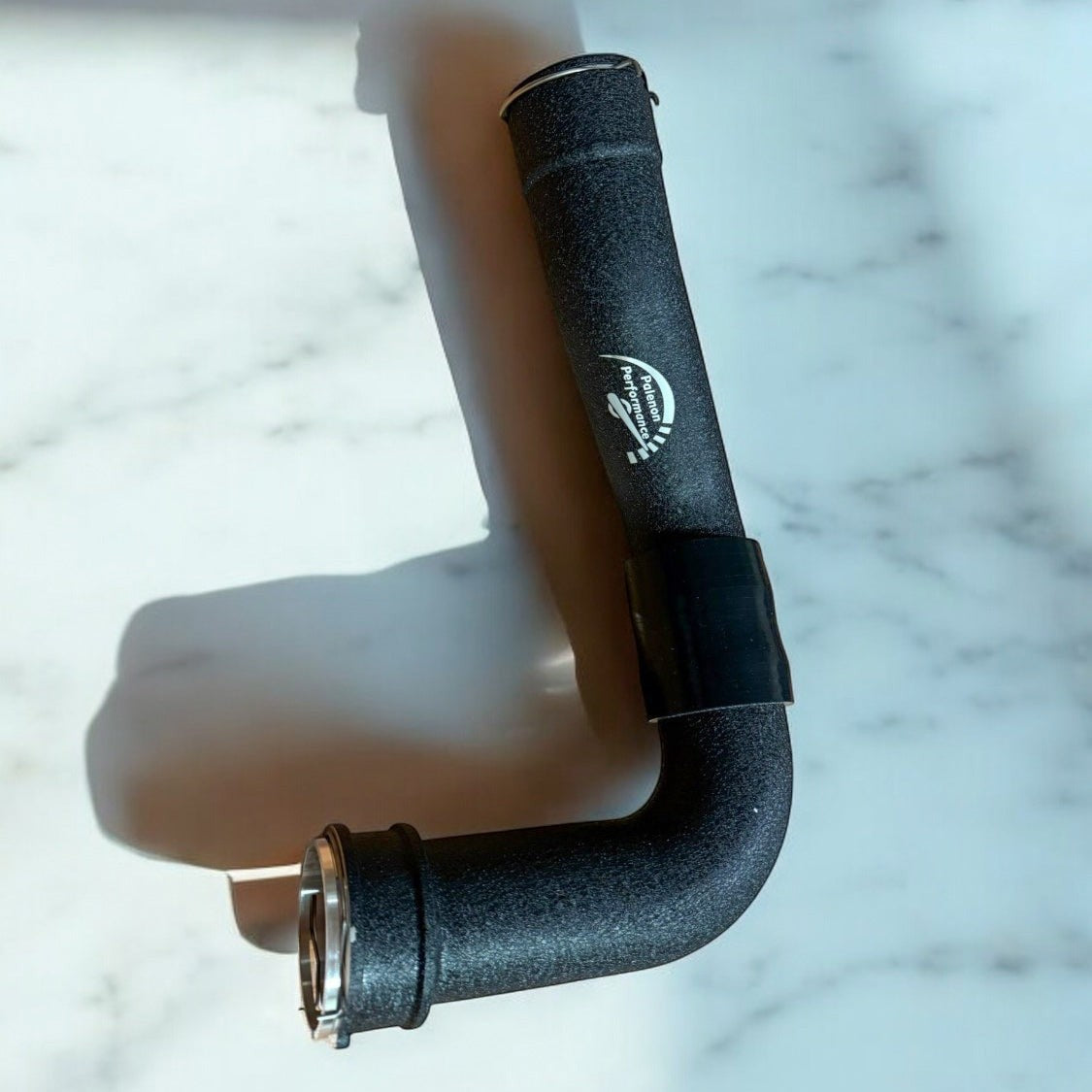 Palenon Performance matte black aluminum S58 charge pipe for BMW G8X engines with branding and metal fittings.