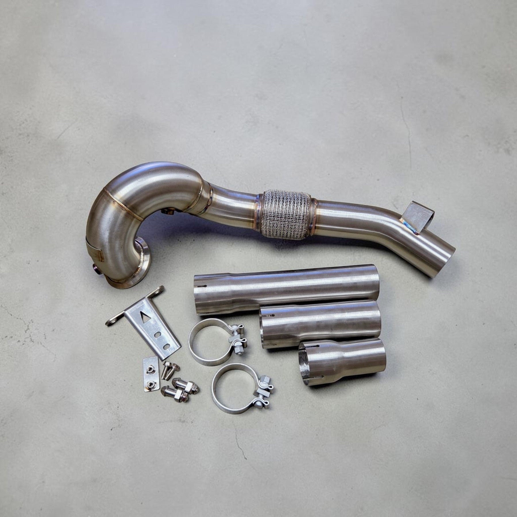 Palenon Performance stainless steel race downpipe kit for VW MK8 GTI and Audi 8Y A3 with mounting hardware and clamps.