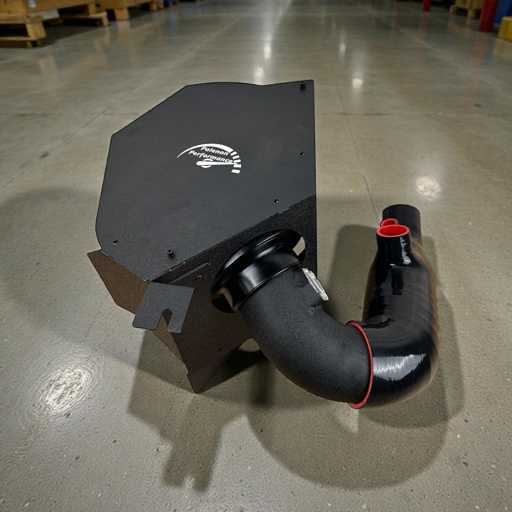 Palenon Performance cold air intake system for Toyota Supra with black powder-coated heat shield and intake pipe.