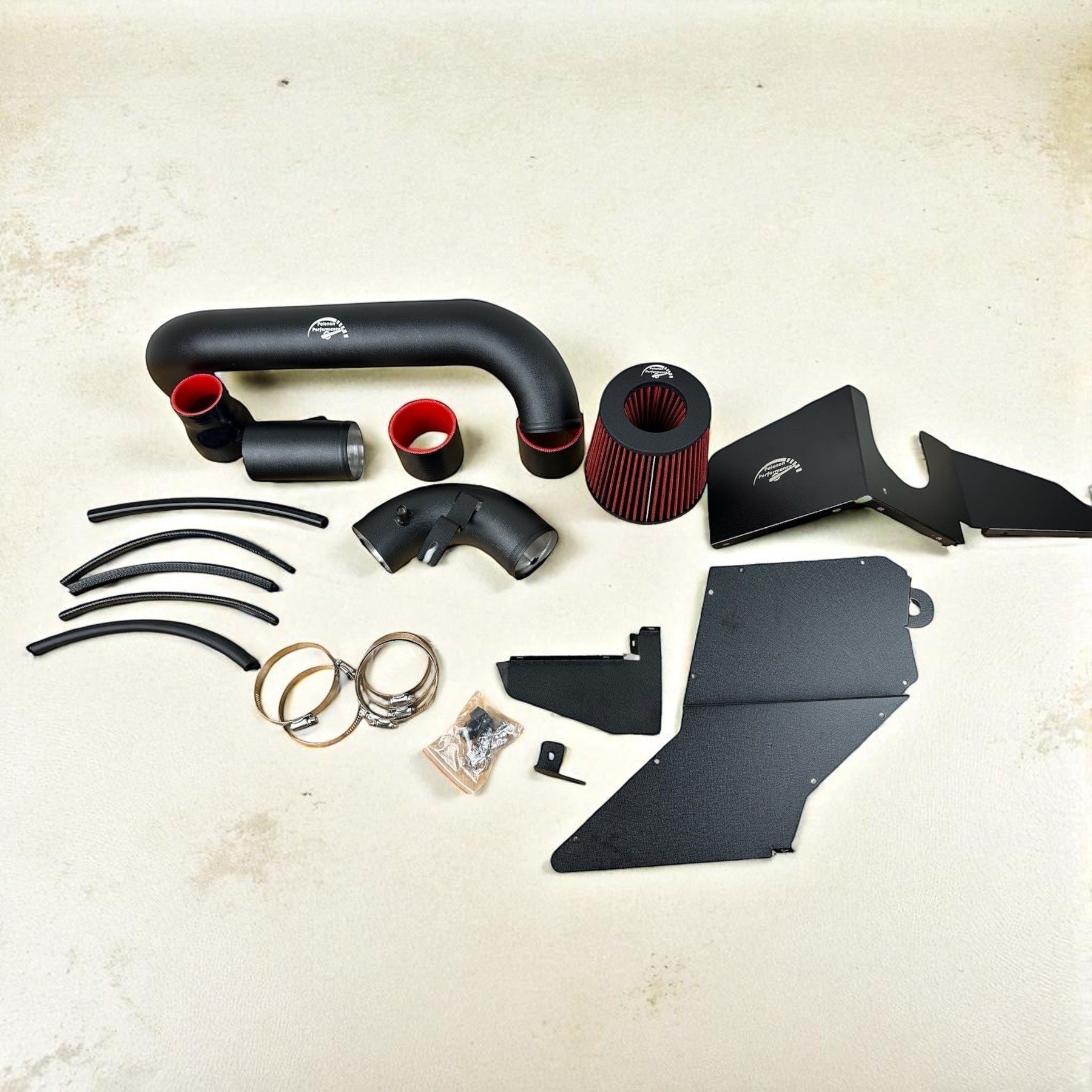 Palenon Performance cold air intake kit for VW MK6 GTI and Golf R featuring black aluminum piping and red air filter.