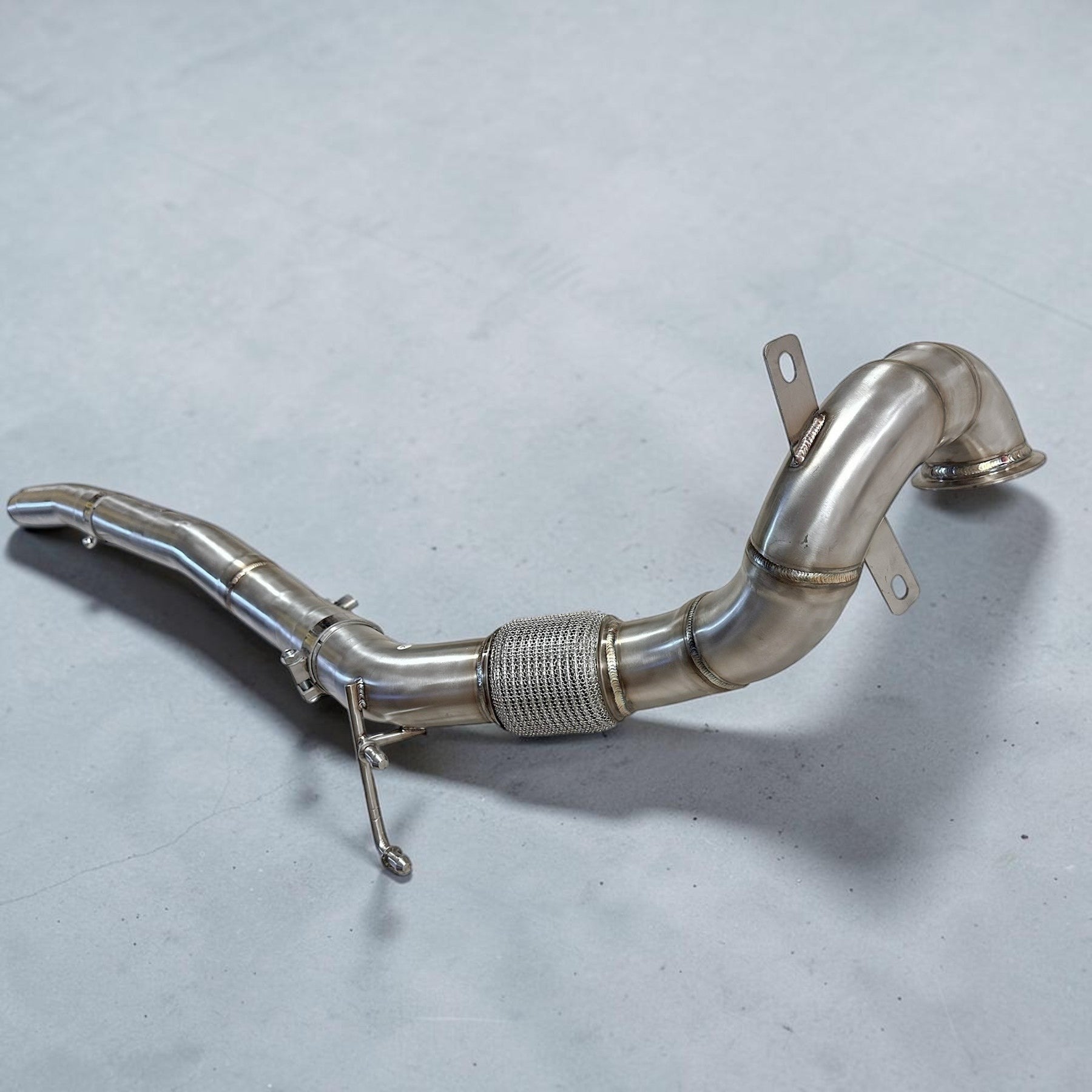 Palenon Performance stainless steel racing downpipe for VW MK7 Golf R featuring TIG-welded joints and flex section.