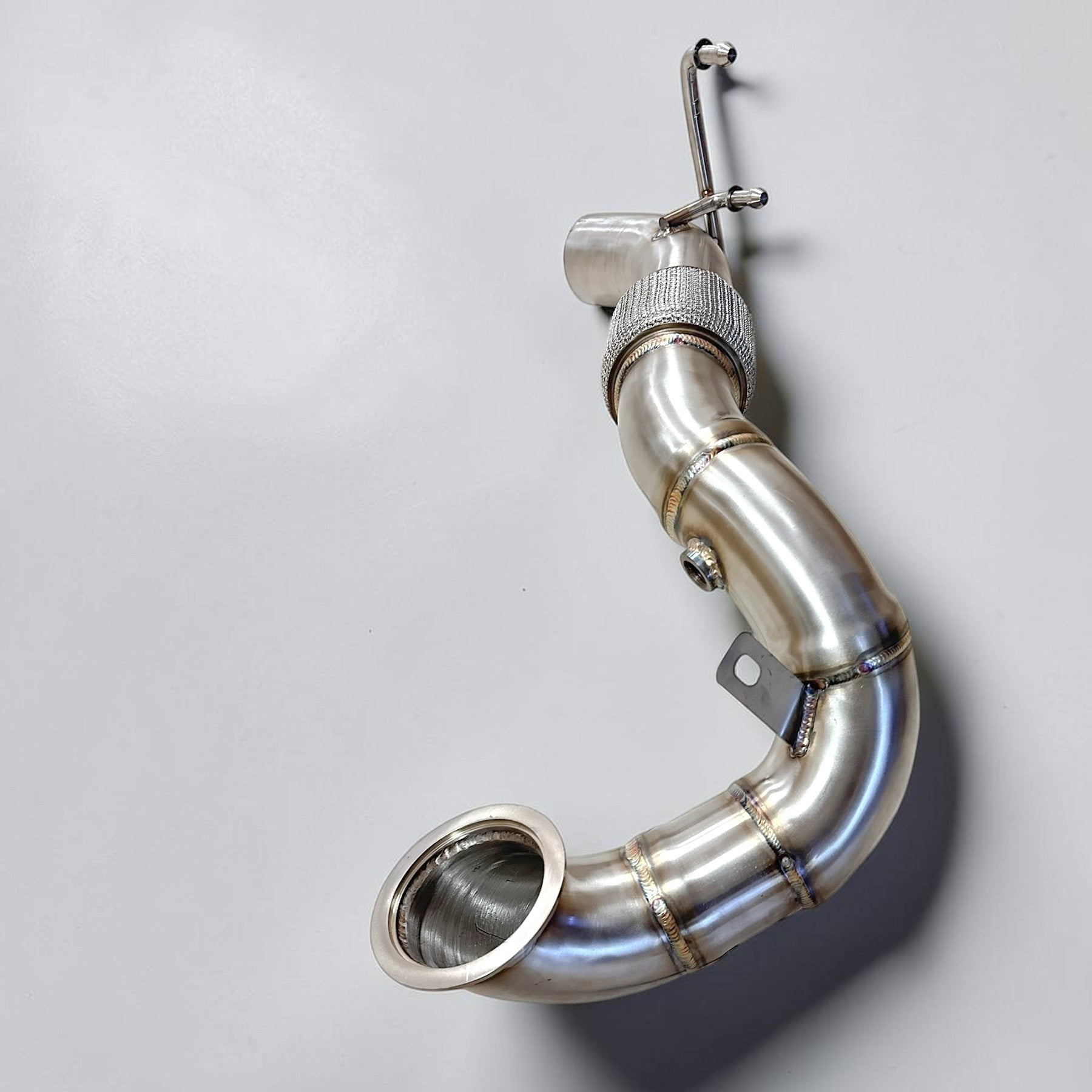 Palenon Performance stainless steel racing downpipe for VW MK7 Golf R featuring TIG-welded joints and flex section.