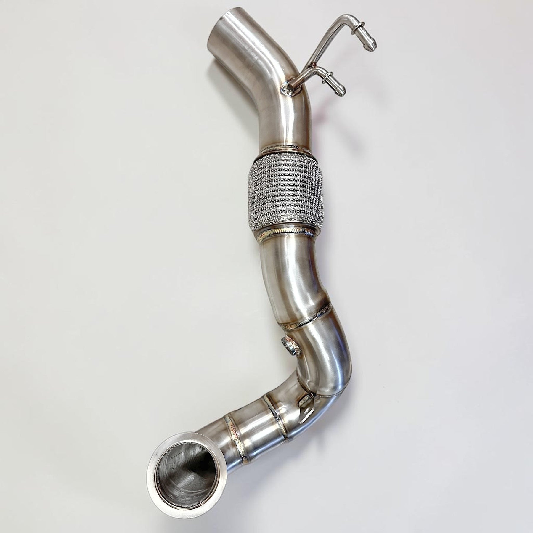 Palenon Performance stainless steel racing downpipe for VW MK7 Golf R featuring TIG-welded joints and a flex section.
